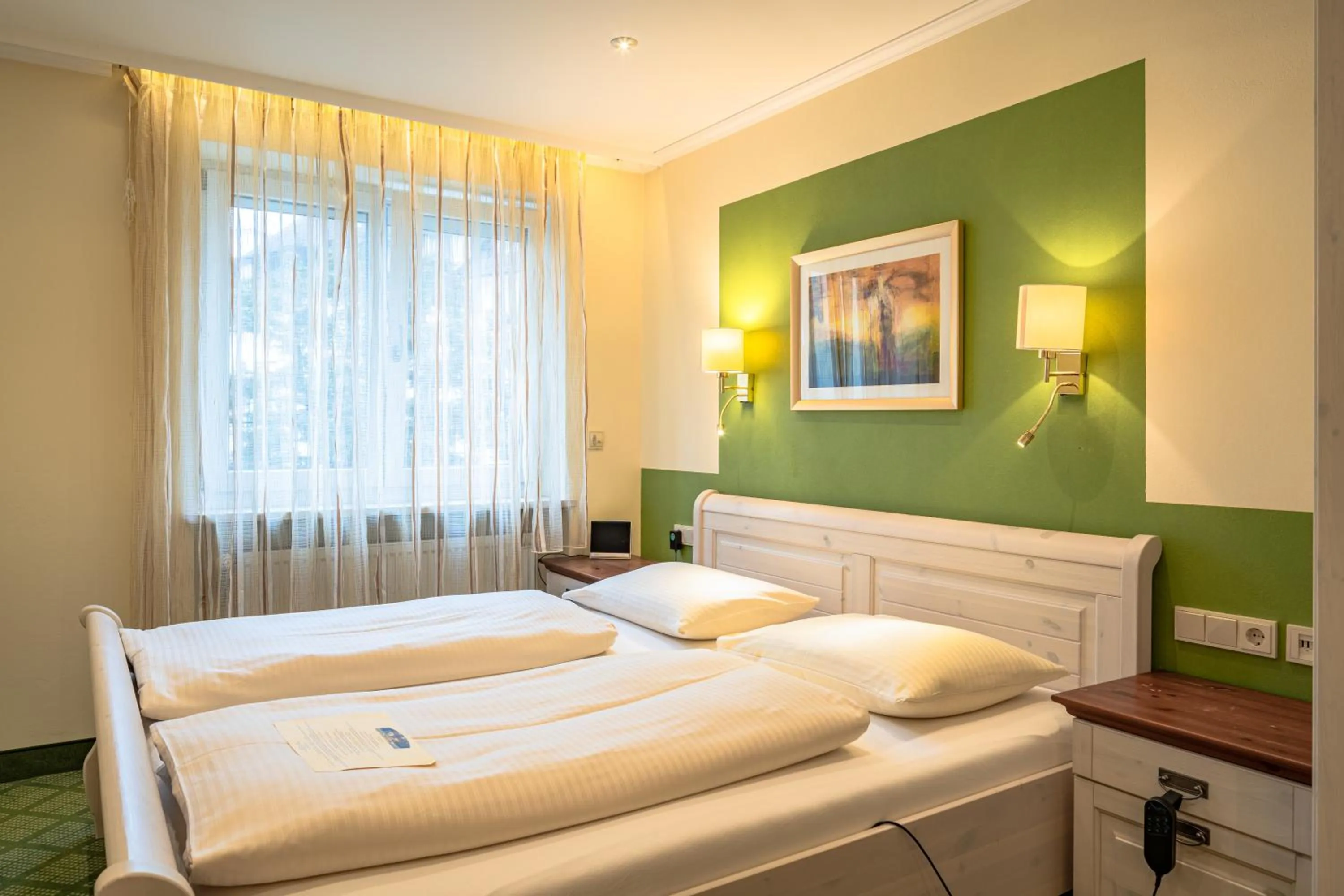 Bed in Parkhotel Crombach