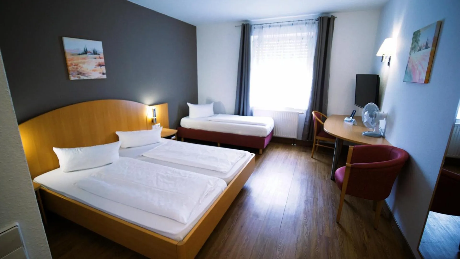 Photo of the whole room, Bed in Hotel SunParc - SHUTTLE zum Europa-Park Rust 4km & Rulantica 2km