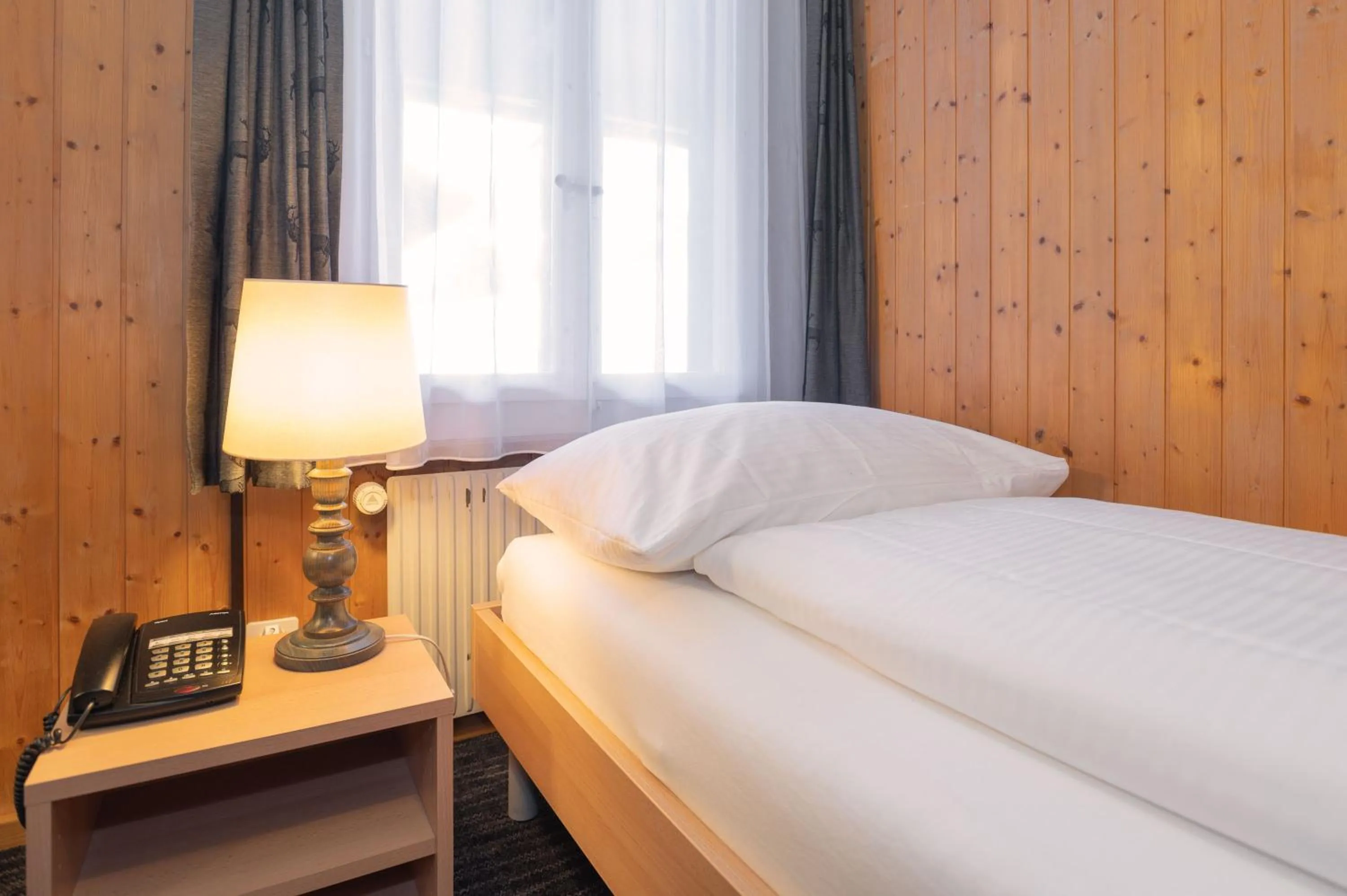 Bedroom, Bed in Jungfrau Lodge, Swiss Mountain Hotel
