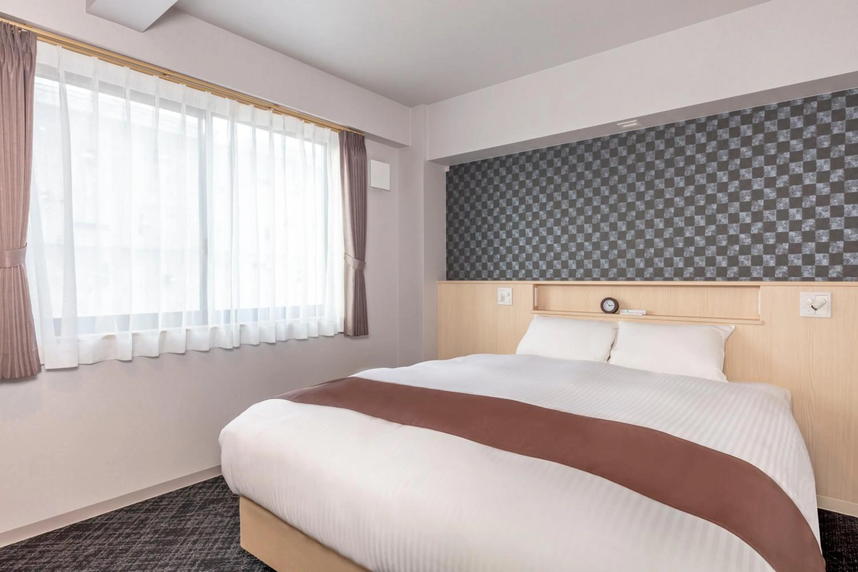 Bed in Hotel GOCO stay Kyoto Shijo Kawaramachi