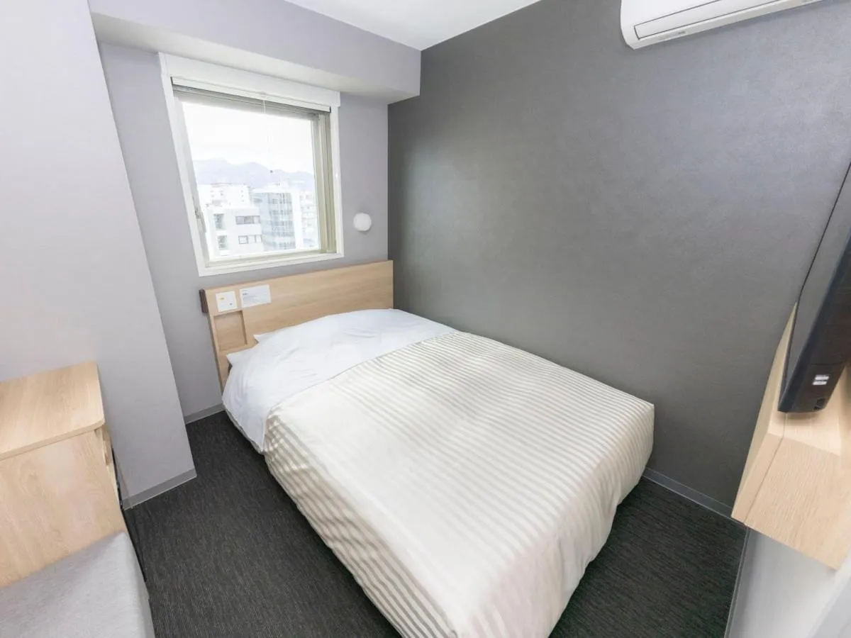 Bed in Super Hotel Sapporo Kitagojo Dori