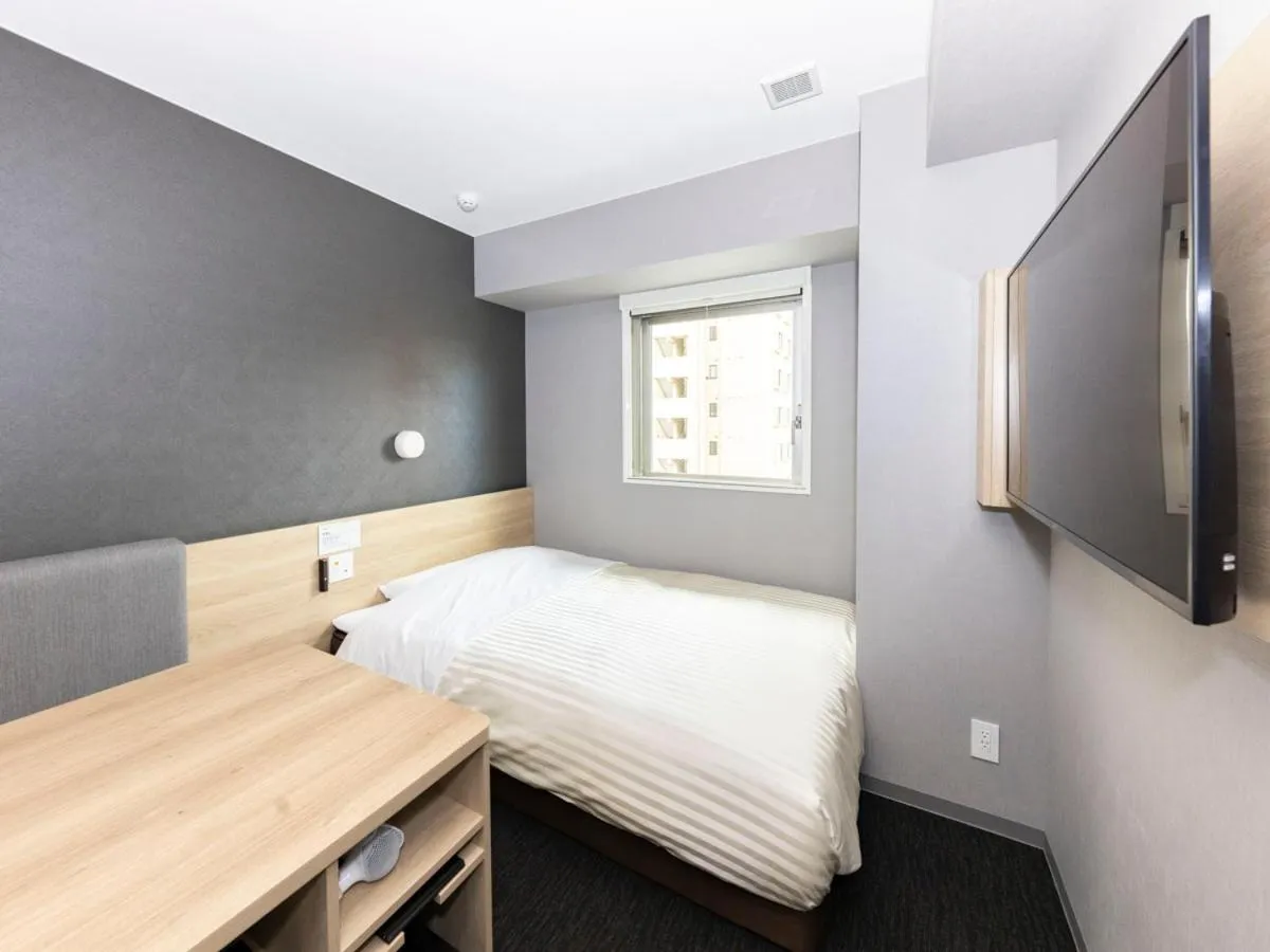 Bed in Super Hotel Sapporo Kitagojo Dori