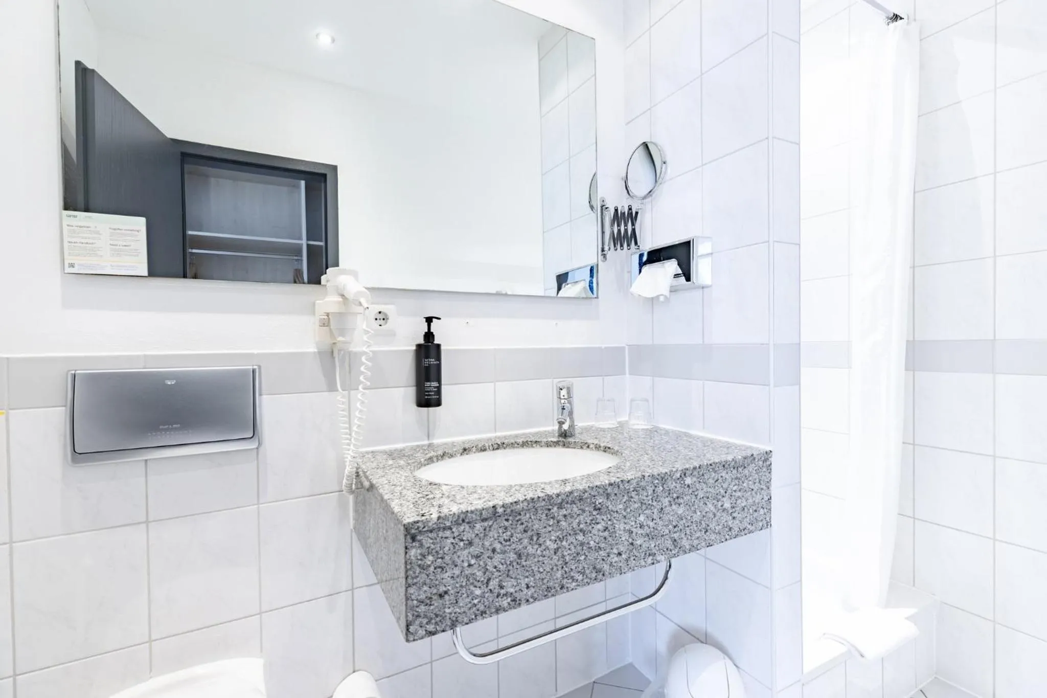 Bathroom in Garner Hotel Cologne Porz - Airport by IHG