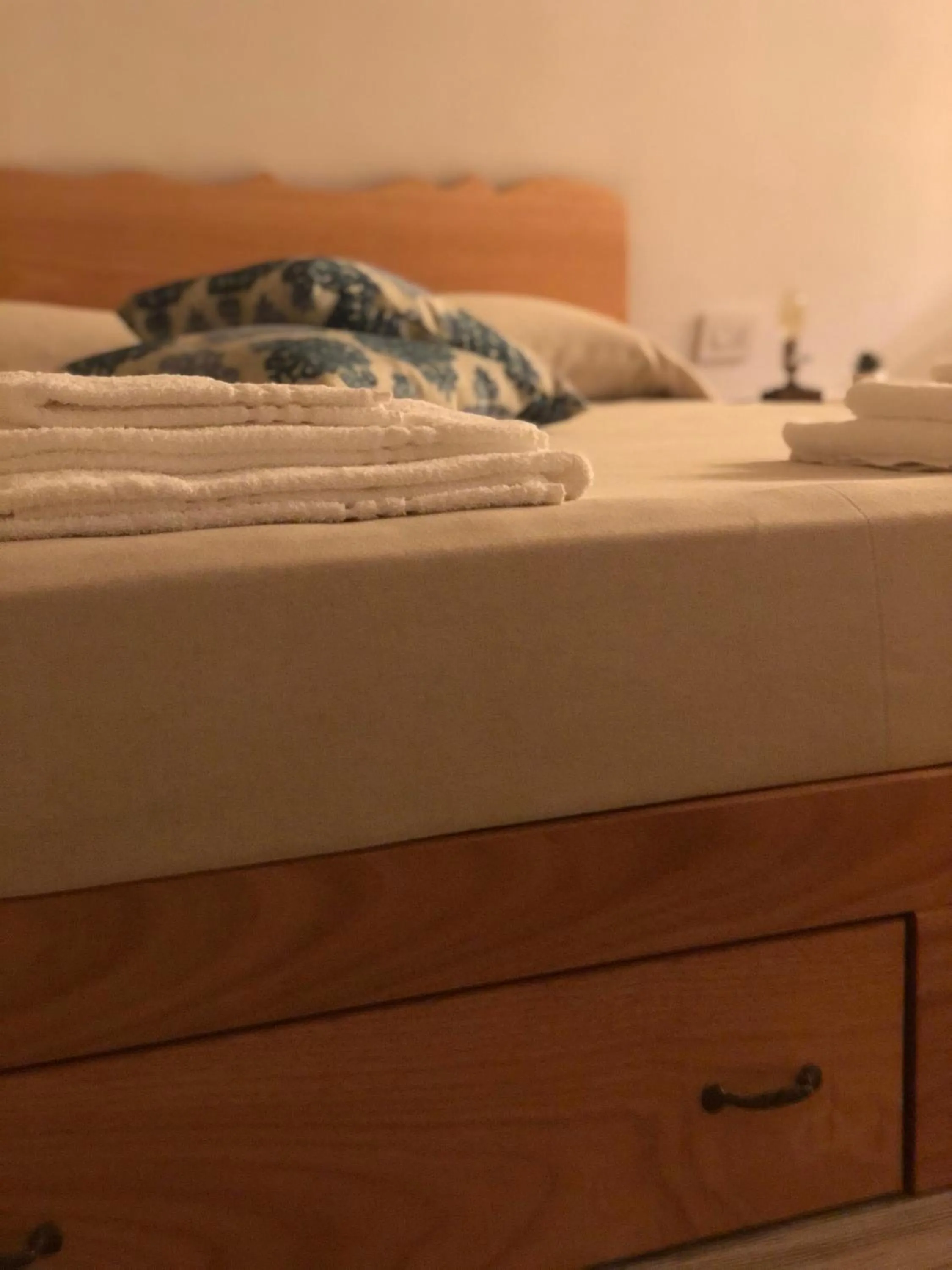 Bed in Il Galletto Viola, luxury room & suite