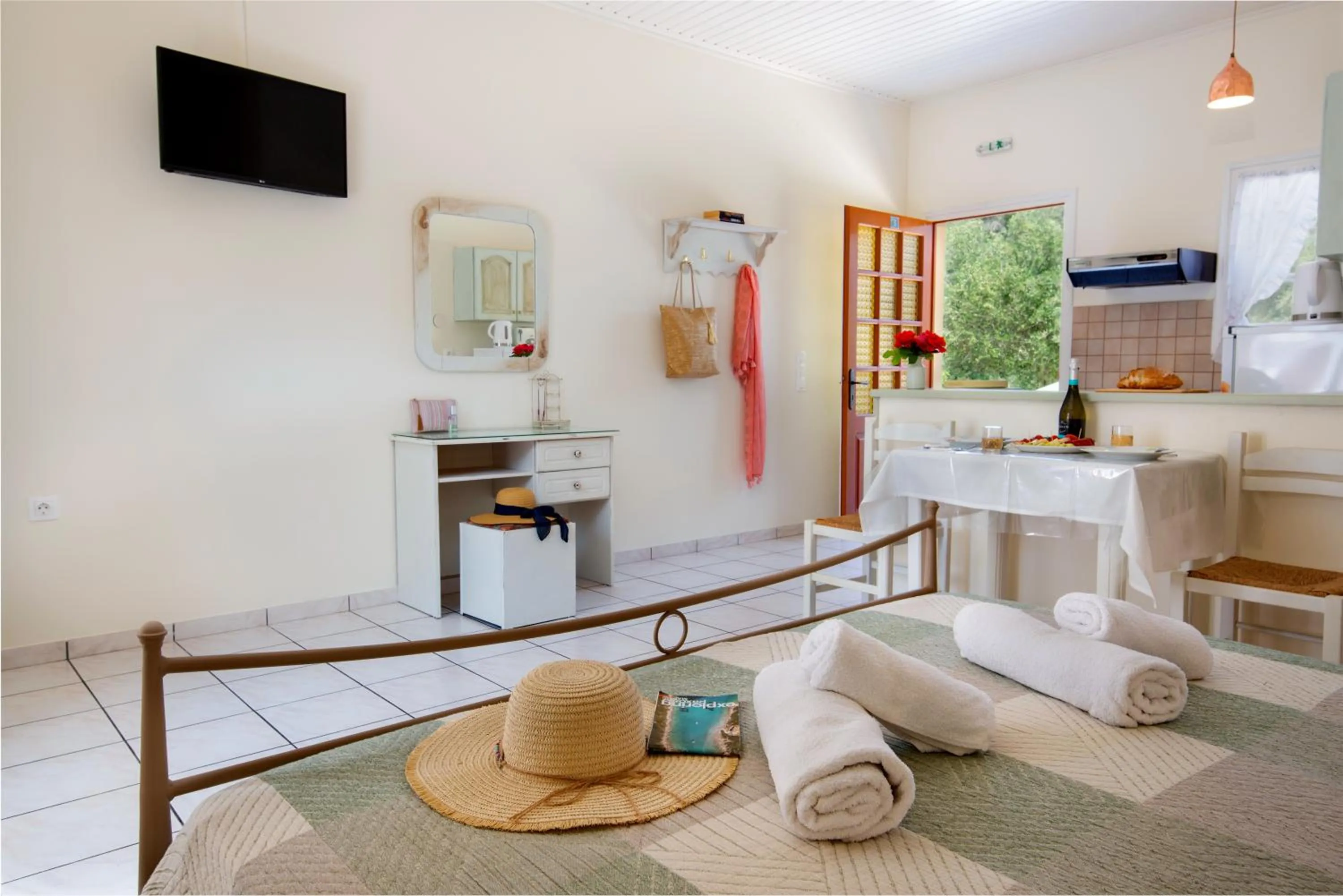 Communal lounge/ TV room in LIvadi Studios with Pool