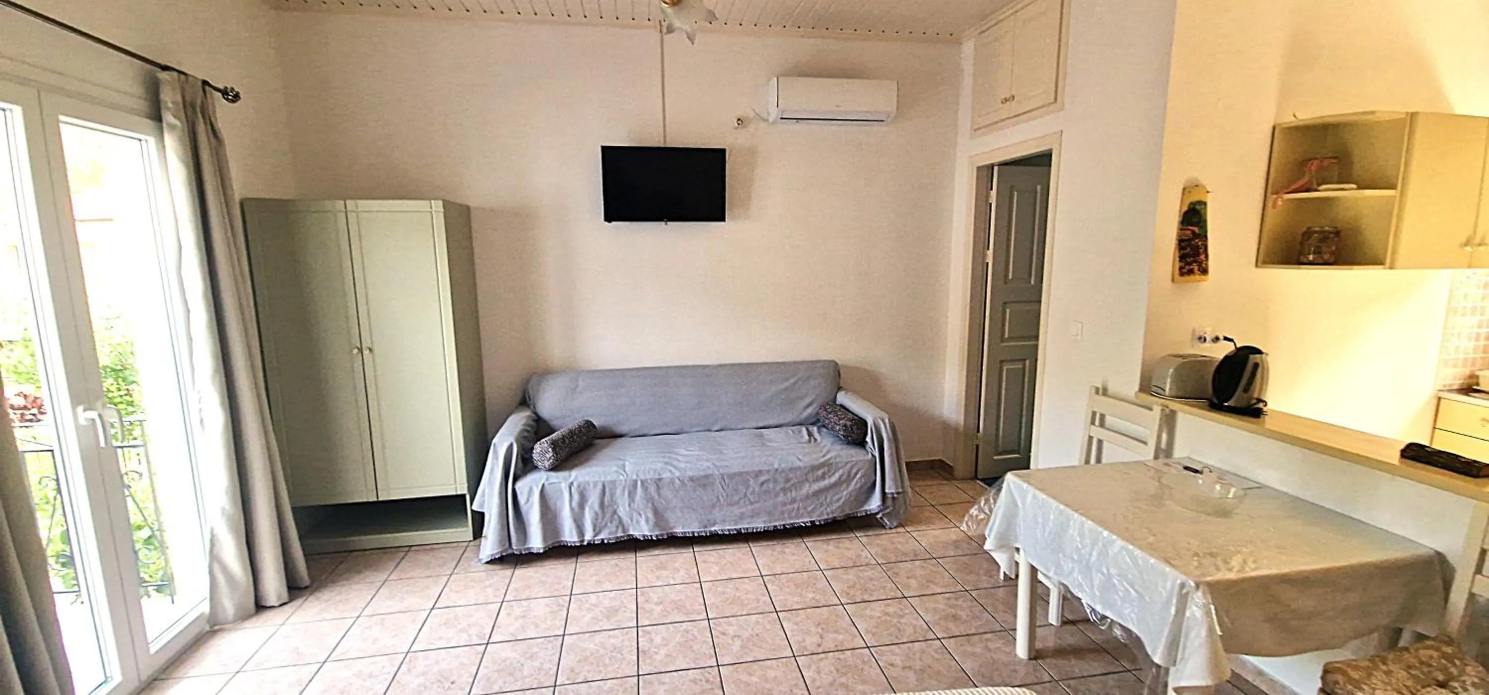 Dining area in LIvadi Studios with Pool