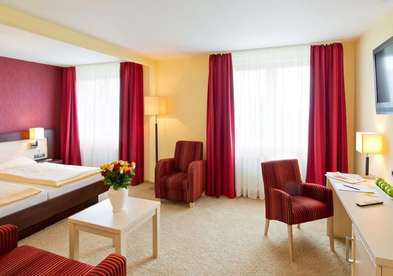 Photo of the whole room, Bed in Ringhotel Roggenland