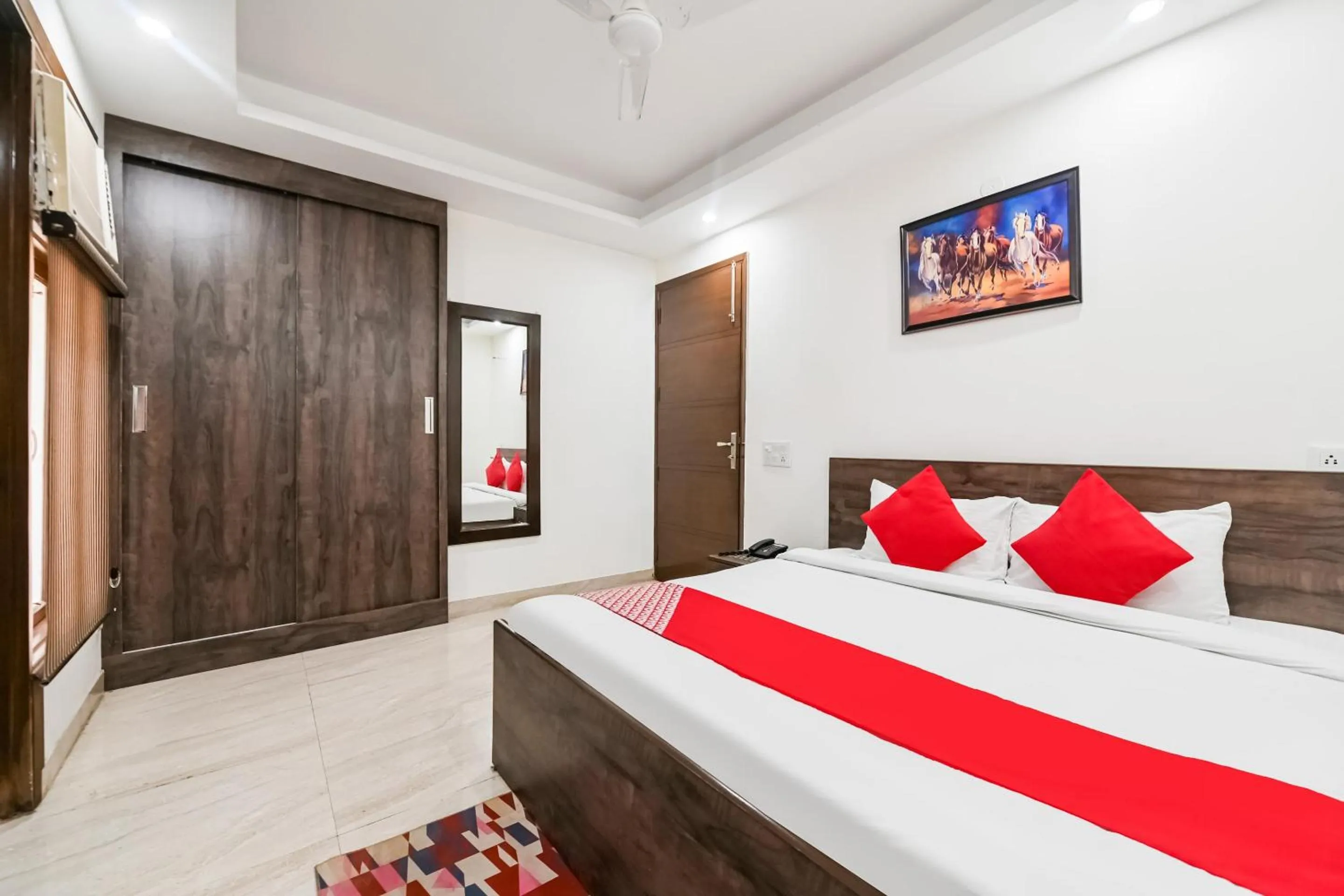 Bedroom in OYO White Rose Wallon Hotel Near Qutab Minar Metro Station