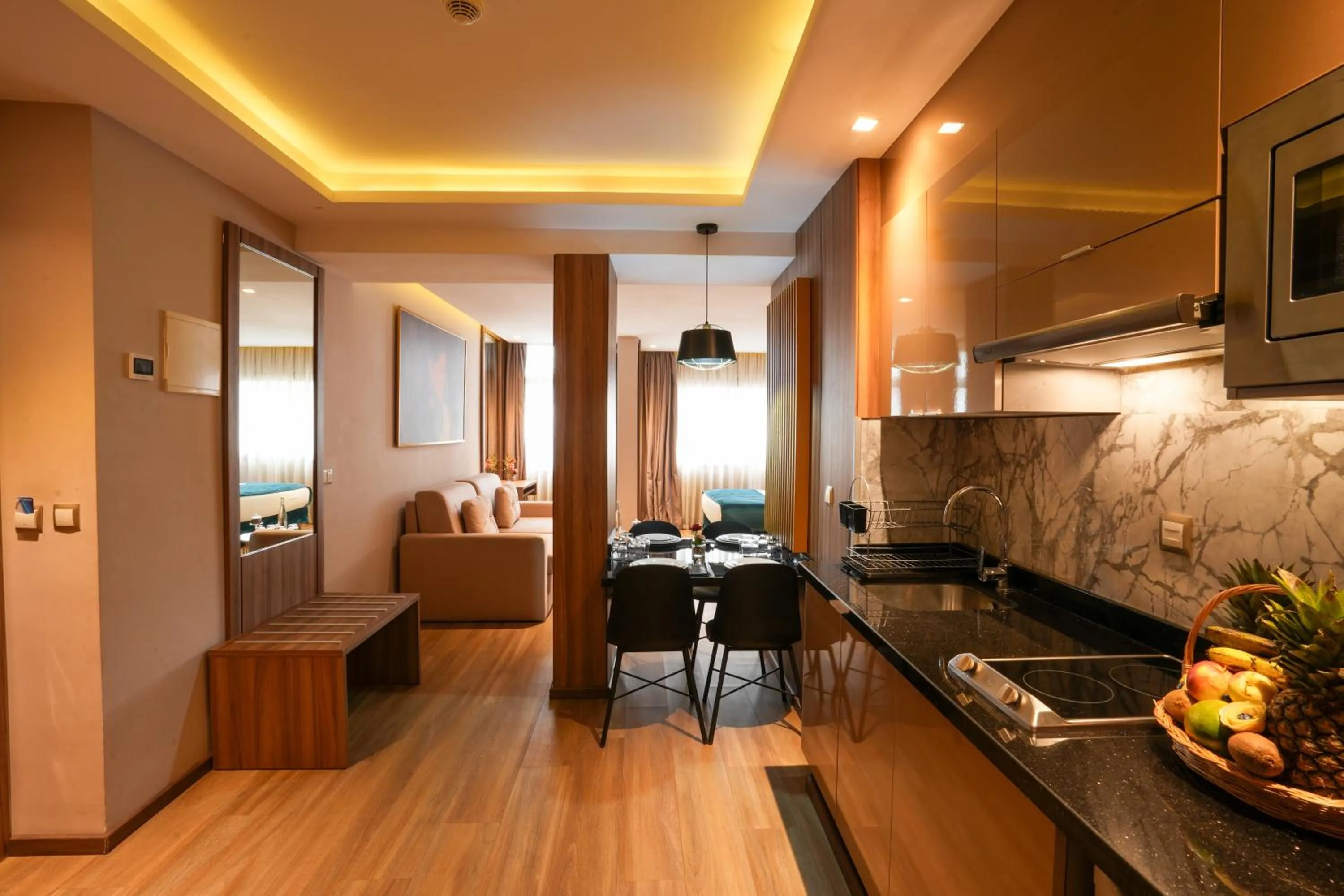 Kitchen or kitchenette in First Suites Hôtel