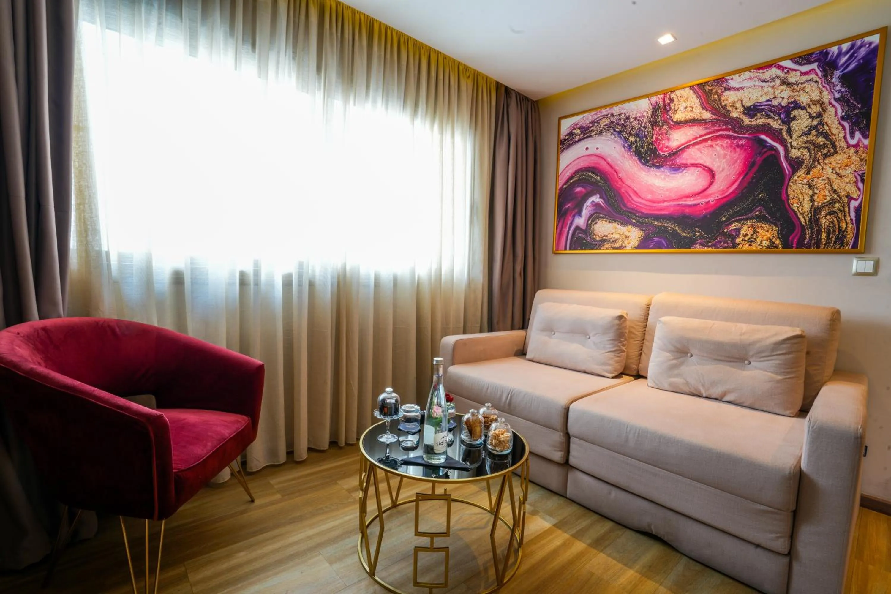 Living room in First Suites Hôtel