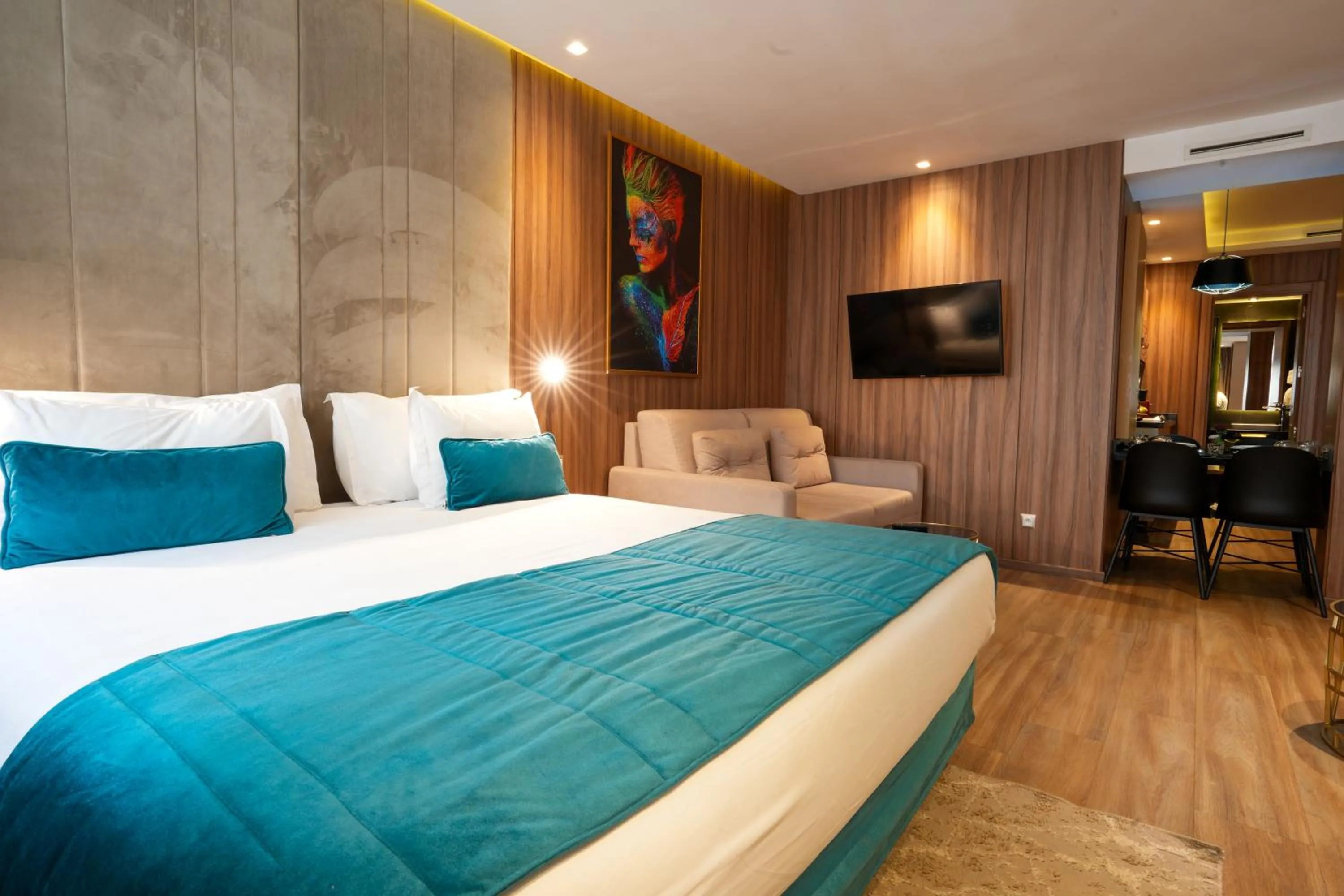 Bed in First Suites Hôtel