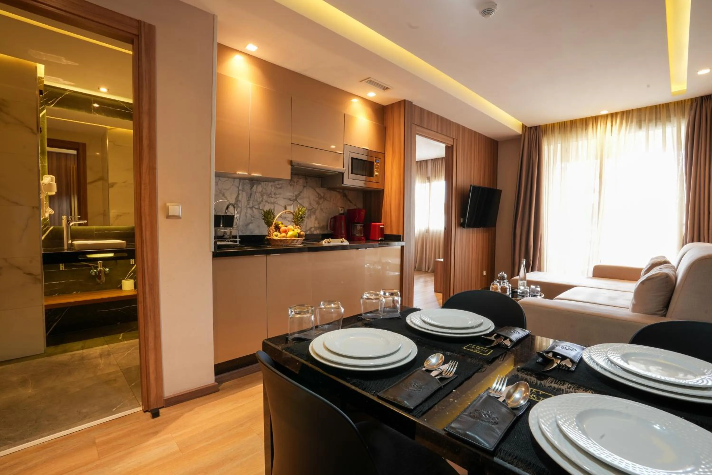 Kitchen or kitchenette in First Suites Hôtel