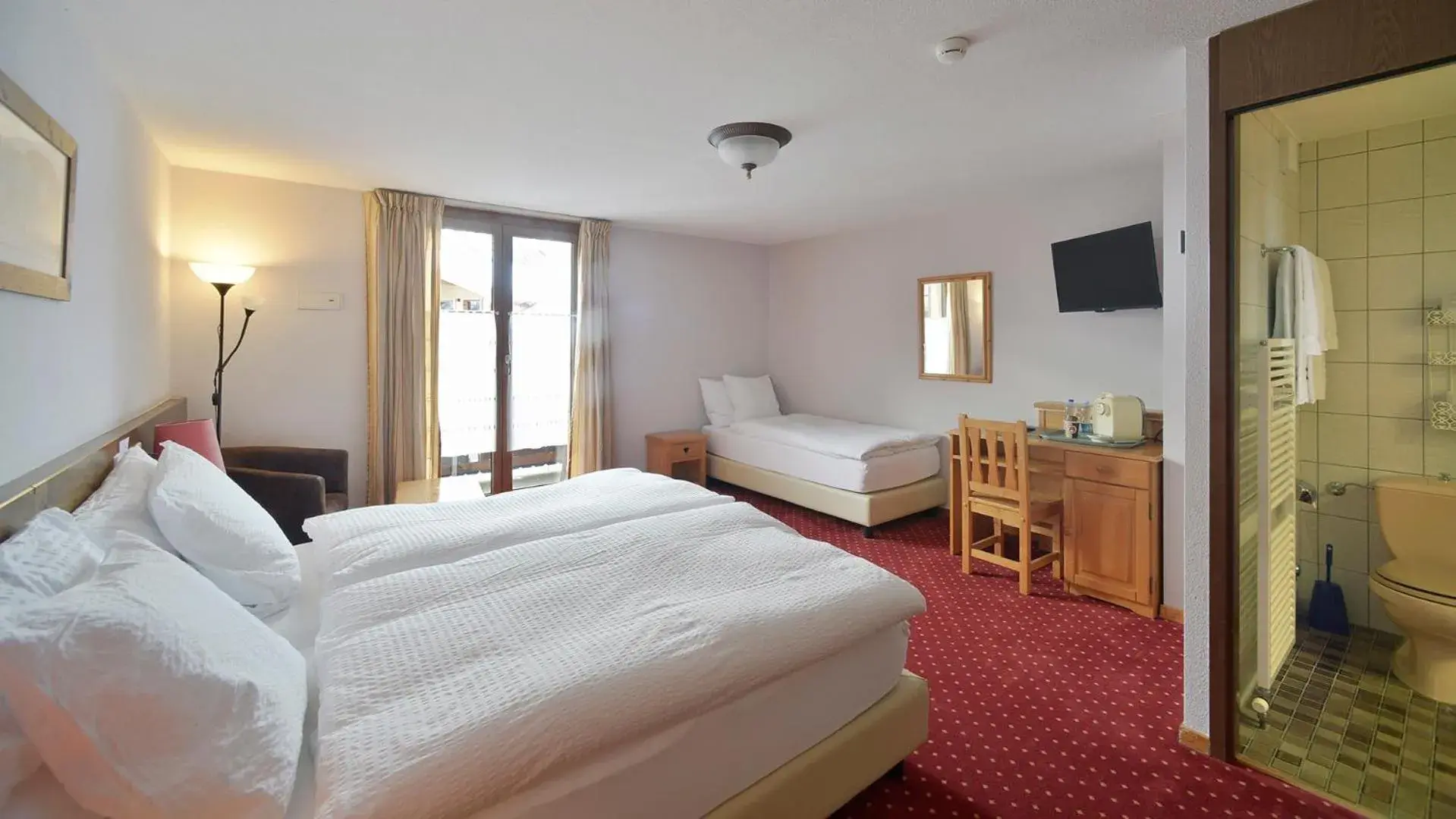 Triple Room with Balcony in Le Chamois Triple Room with Balcony in Le Chamois