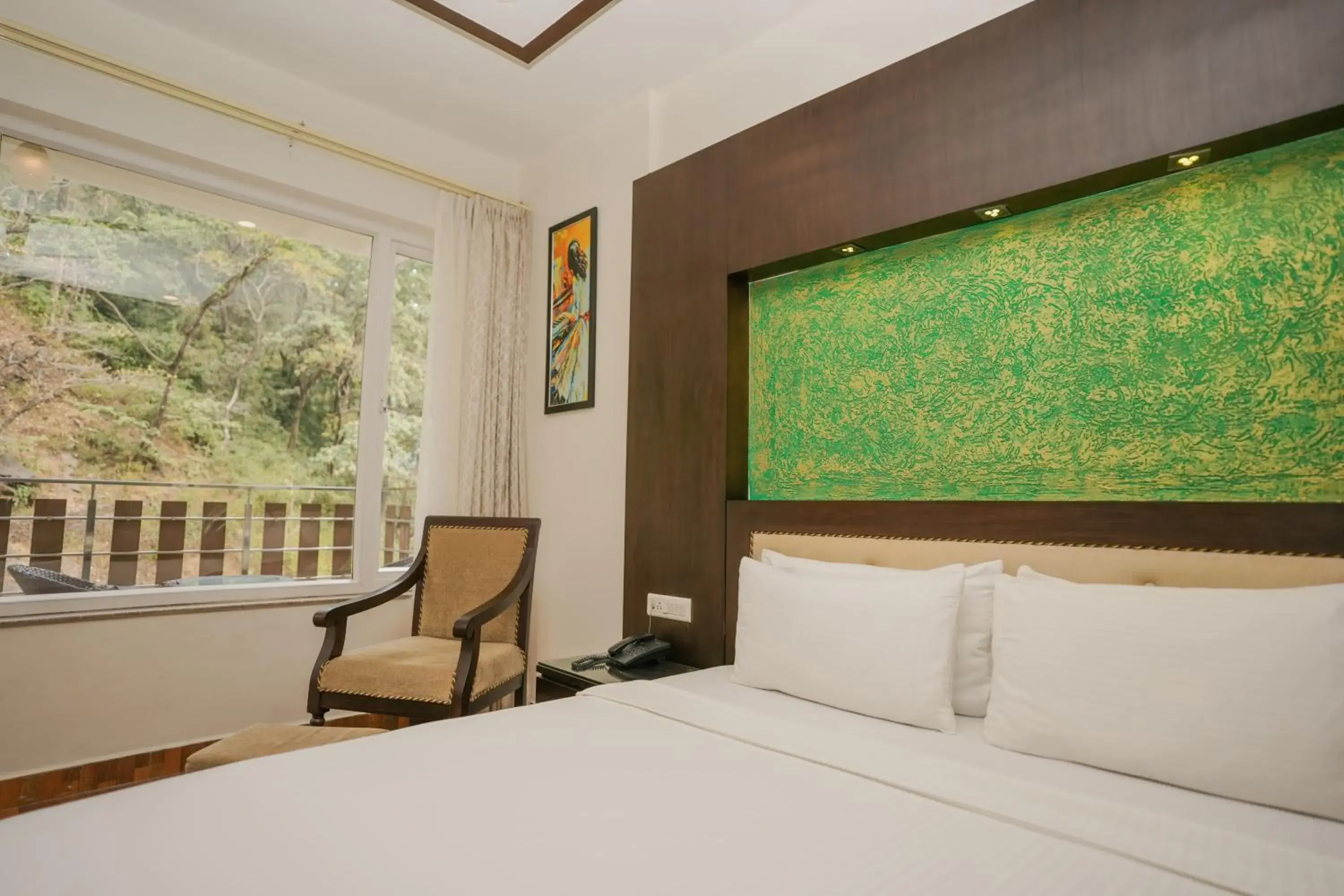 Bed in The Grand Shiva Resort and Spa Bed in The Grand Shiva Resort and Spa