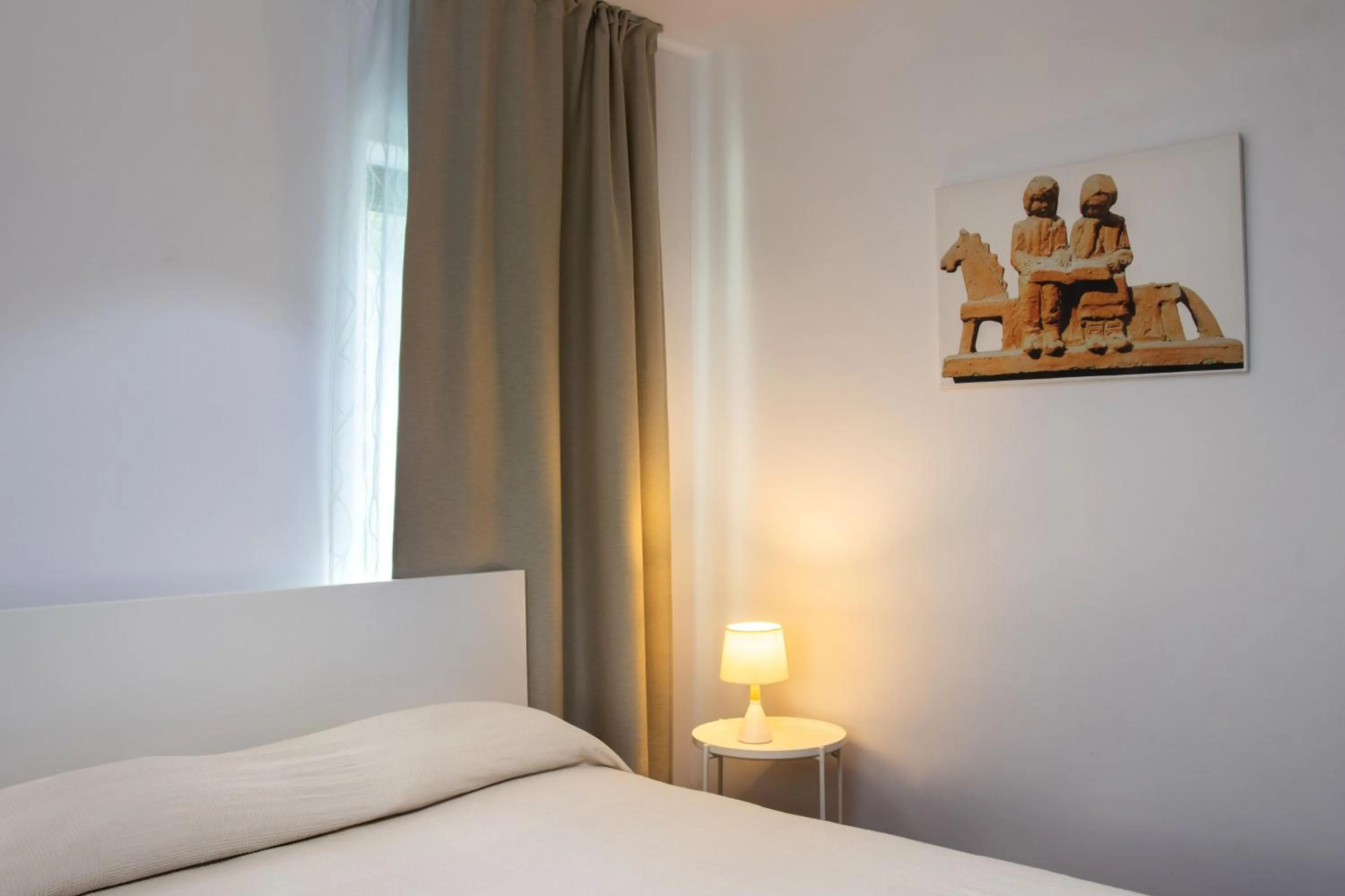 Bed in Clement Apartments