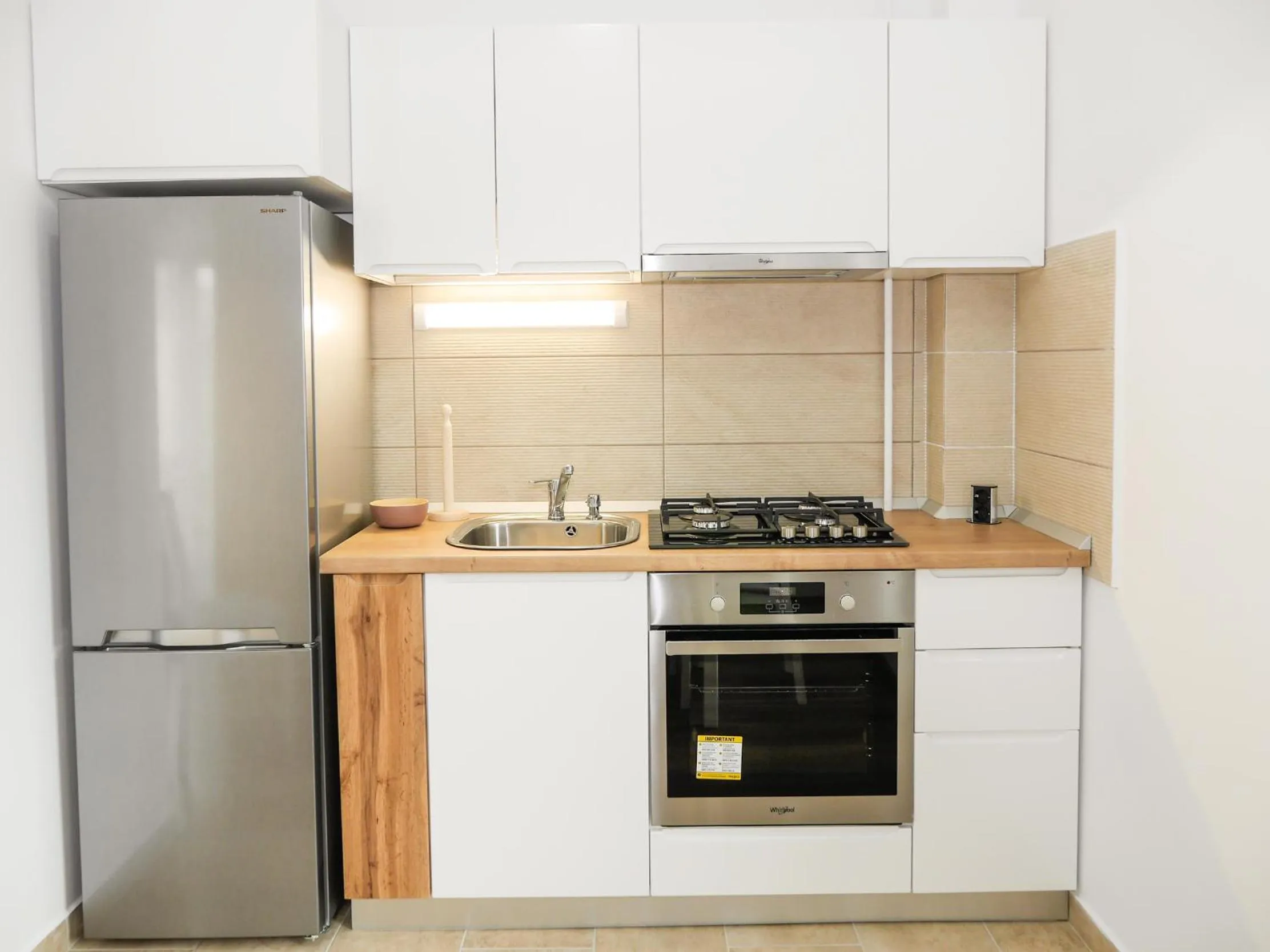 Kitchen or kitchenette in Clement Apartments