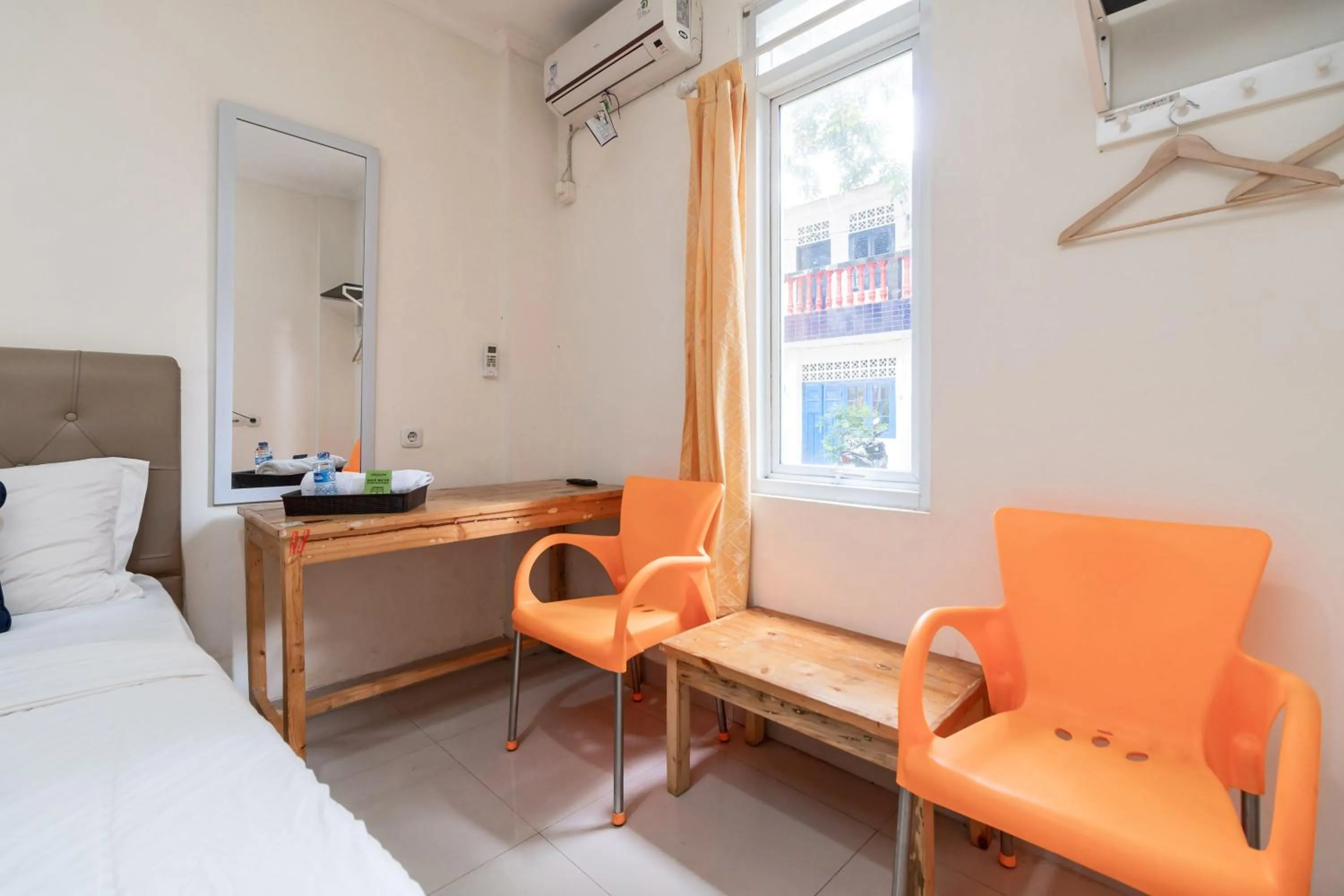 Bed in Urbanview Hotel Minongga Pondok Labu by RedDoorz