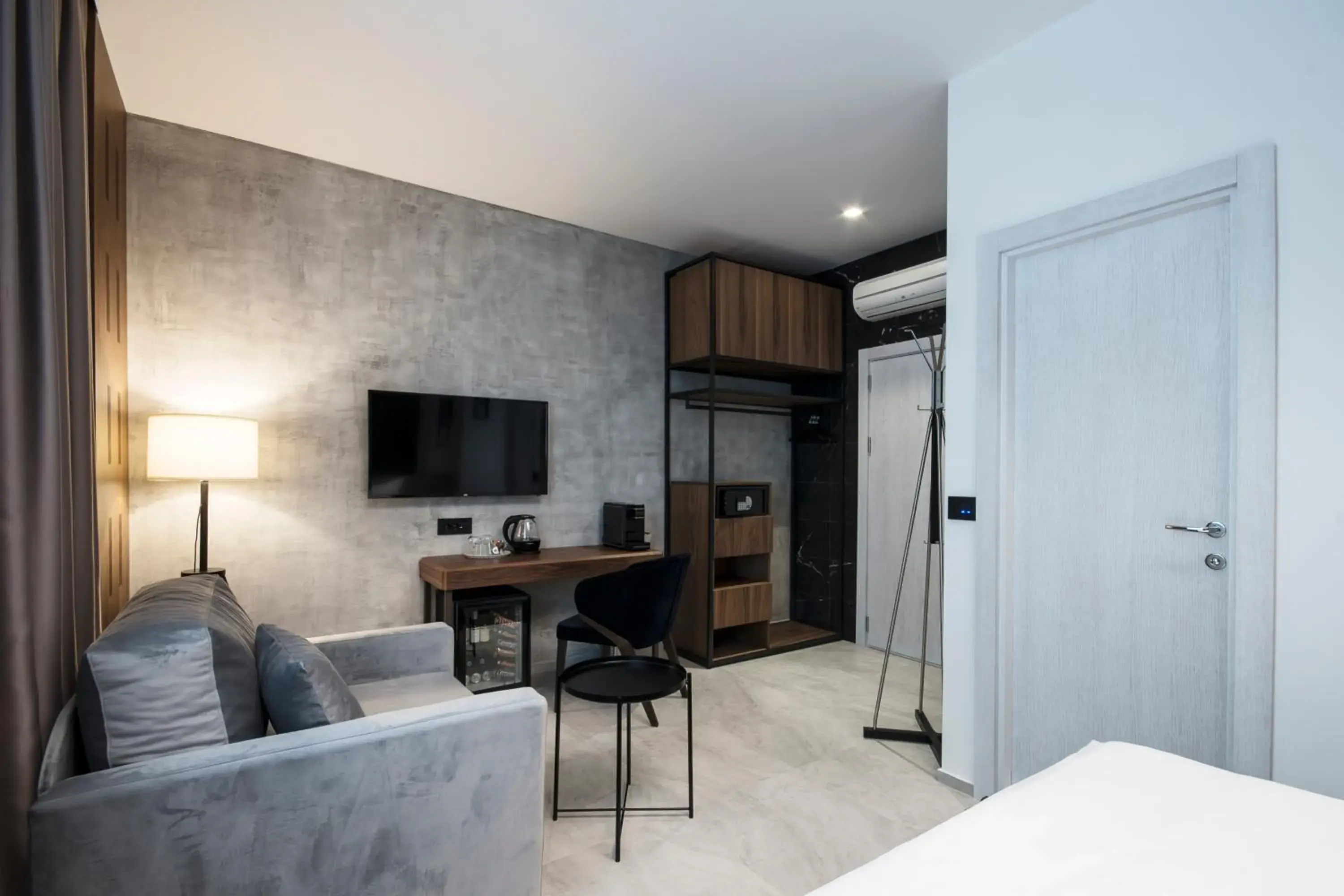 Seating area, Bed in The Location Hotel Seating area, Bed in The Location Hotel