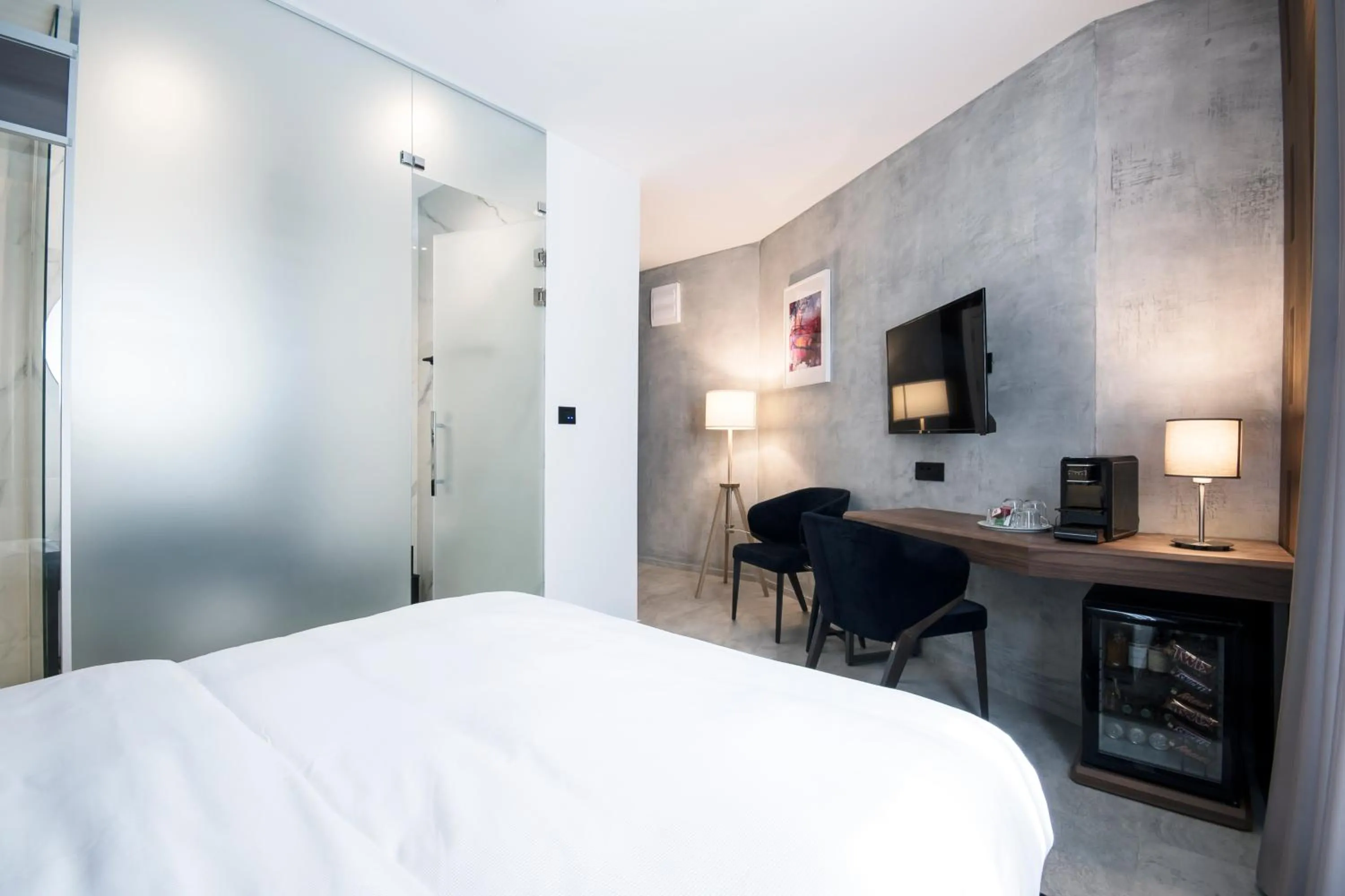 Seating area, Bed in The Location Hotel