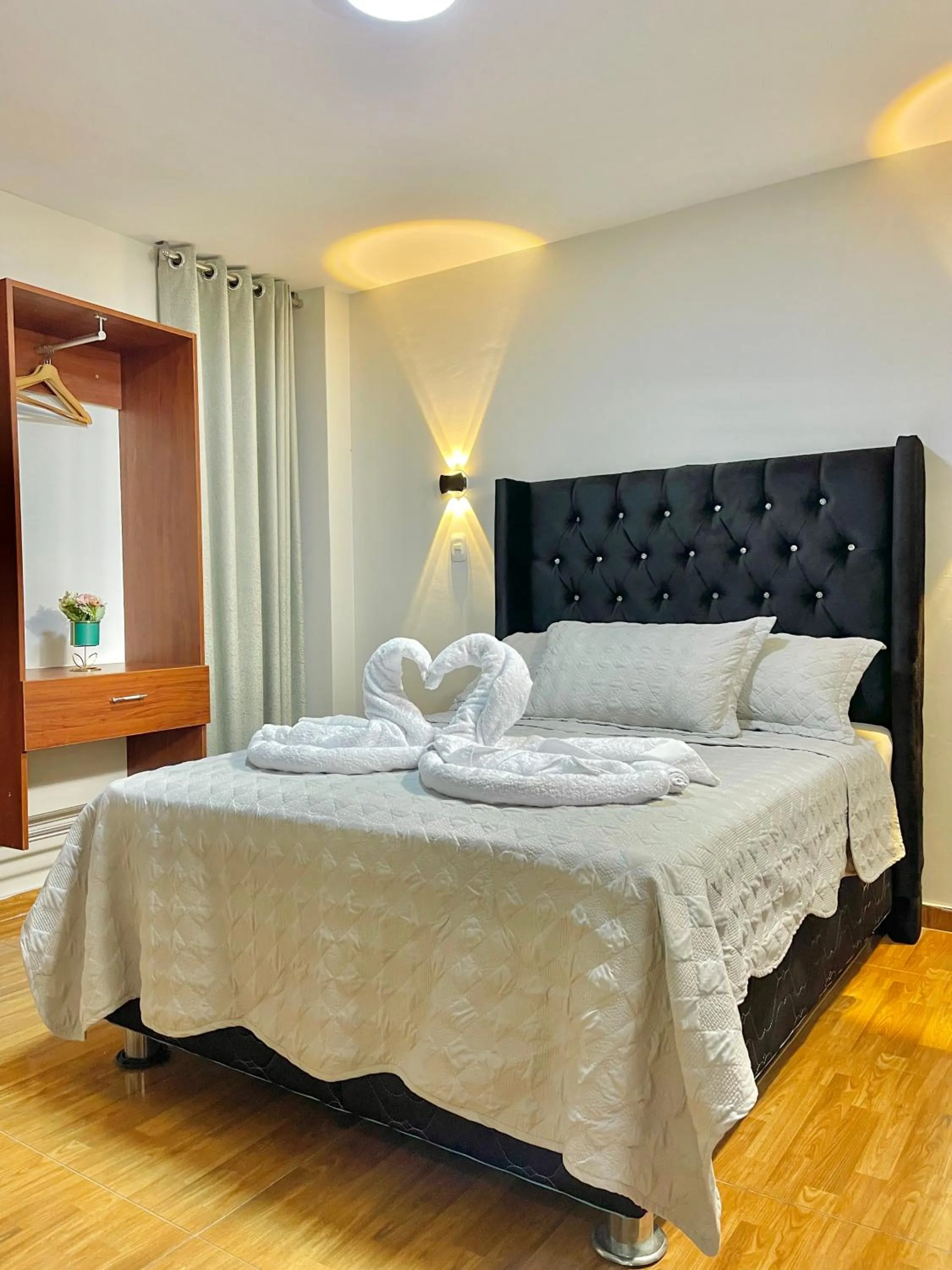 Bed in Jultom Inn Hotel & Suites