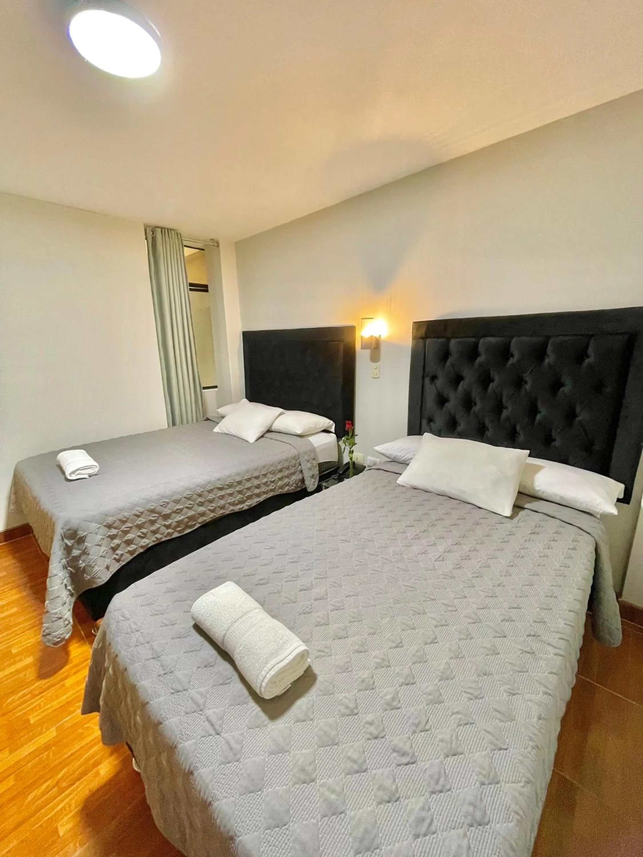 Bed in Jultom Inn Hotel & Suites