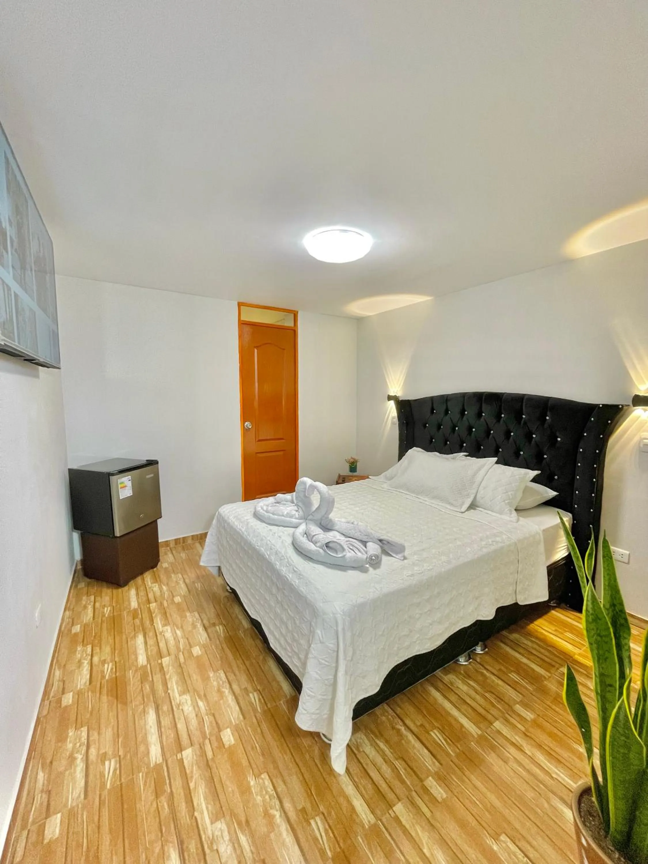 Bed in Jultom Inn Hotel & Suites