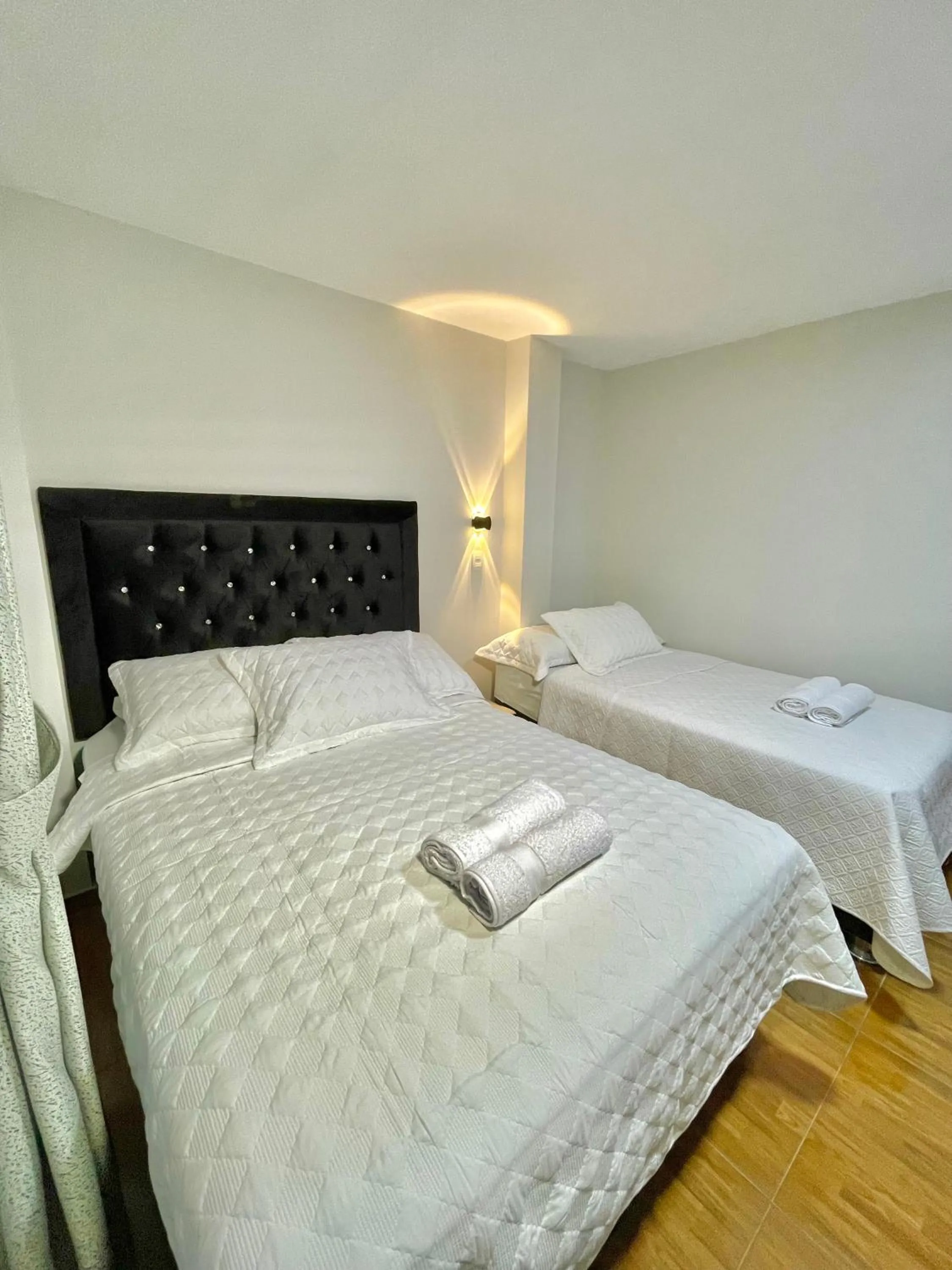 Bed in Jultom Inn Hotel & Suites