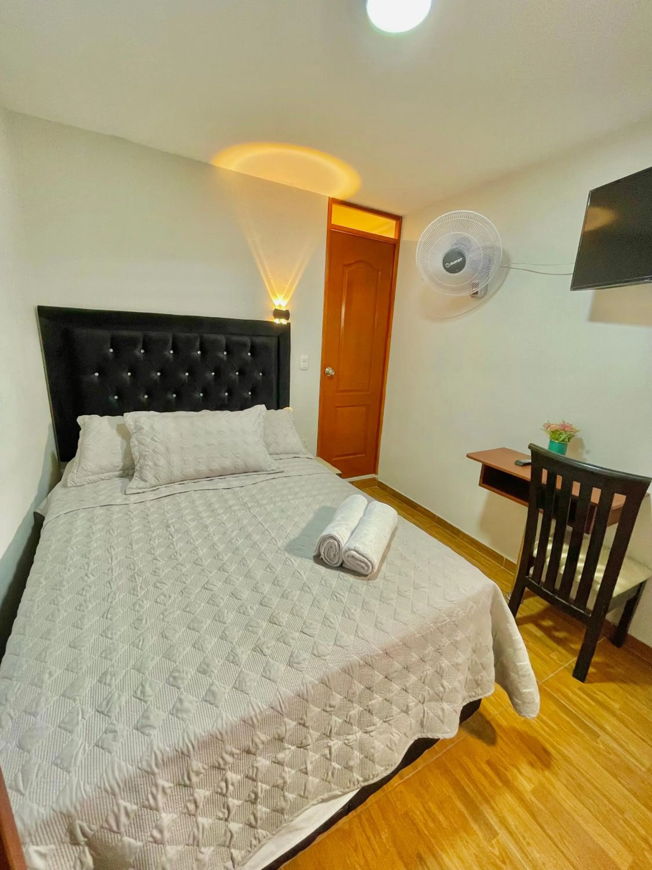 Bed in Jultom Inn Hotel & Suites