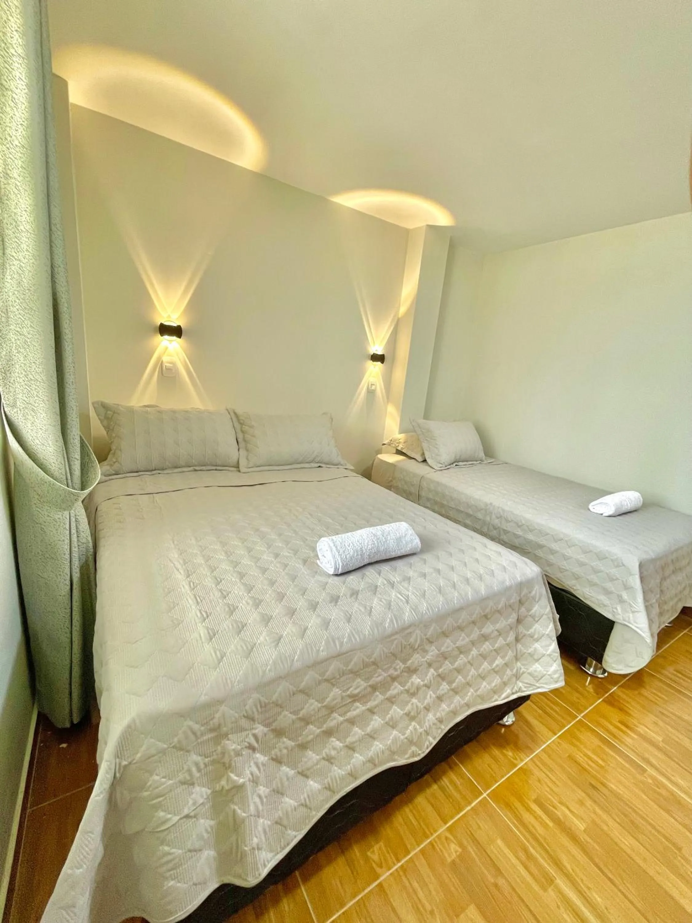 Bed in Jultom Inn Hotel & Suites