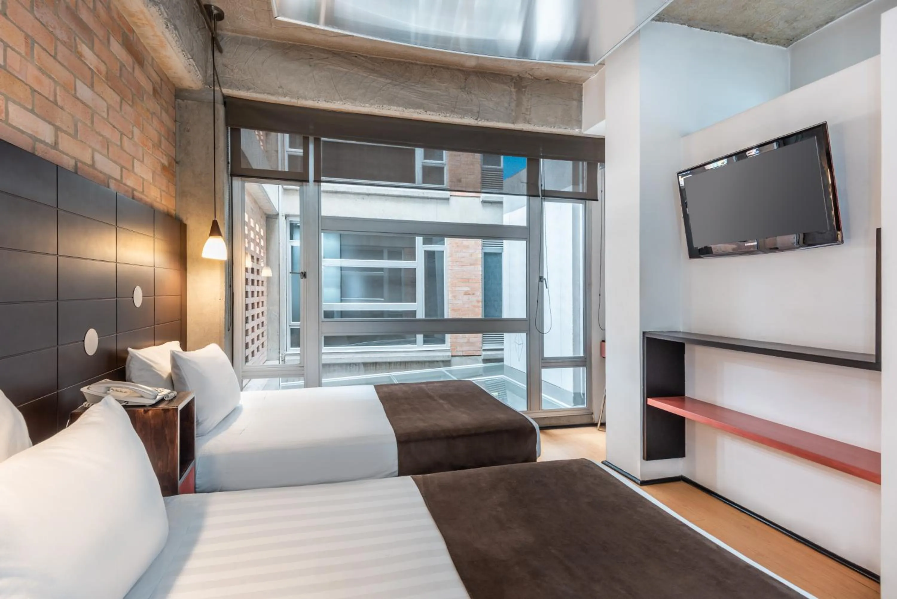 Bed in Hotel 5 Elementos Corferias by HBP