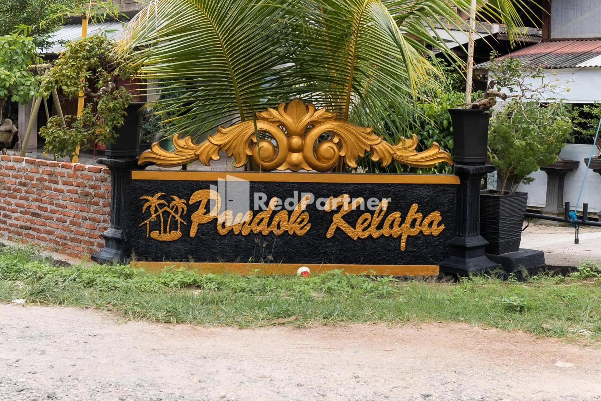 Property logo or sign in Pondok Kelapa Homestay near Unila Lampung RedPartner