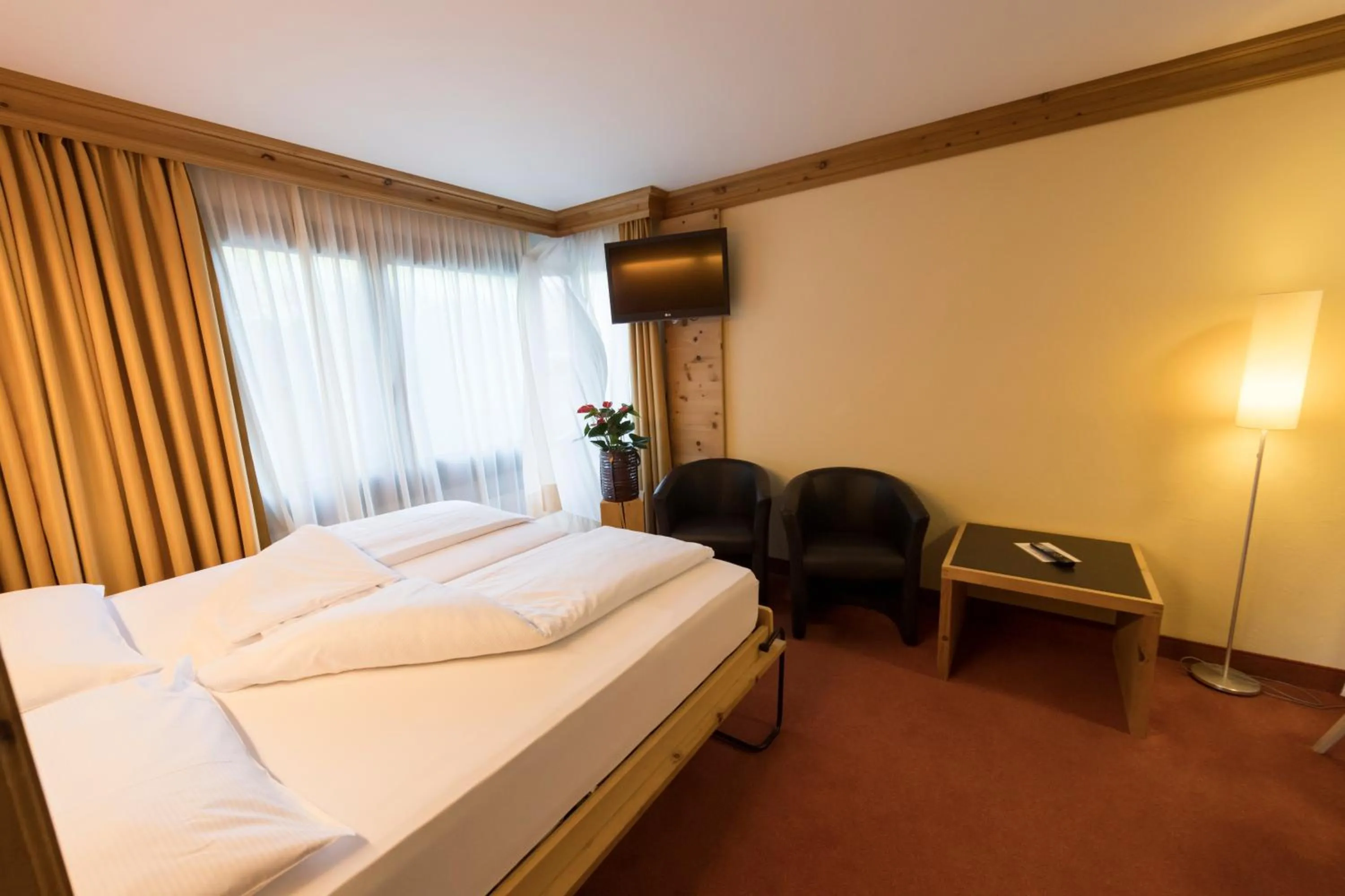 Living room, Bed in Hotel Palü