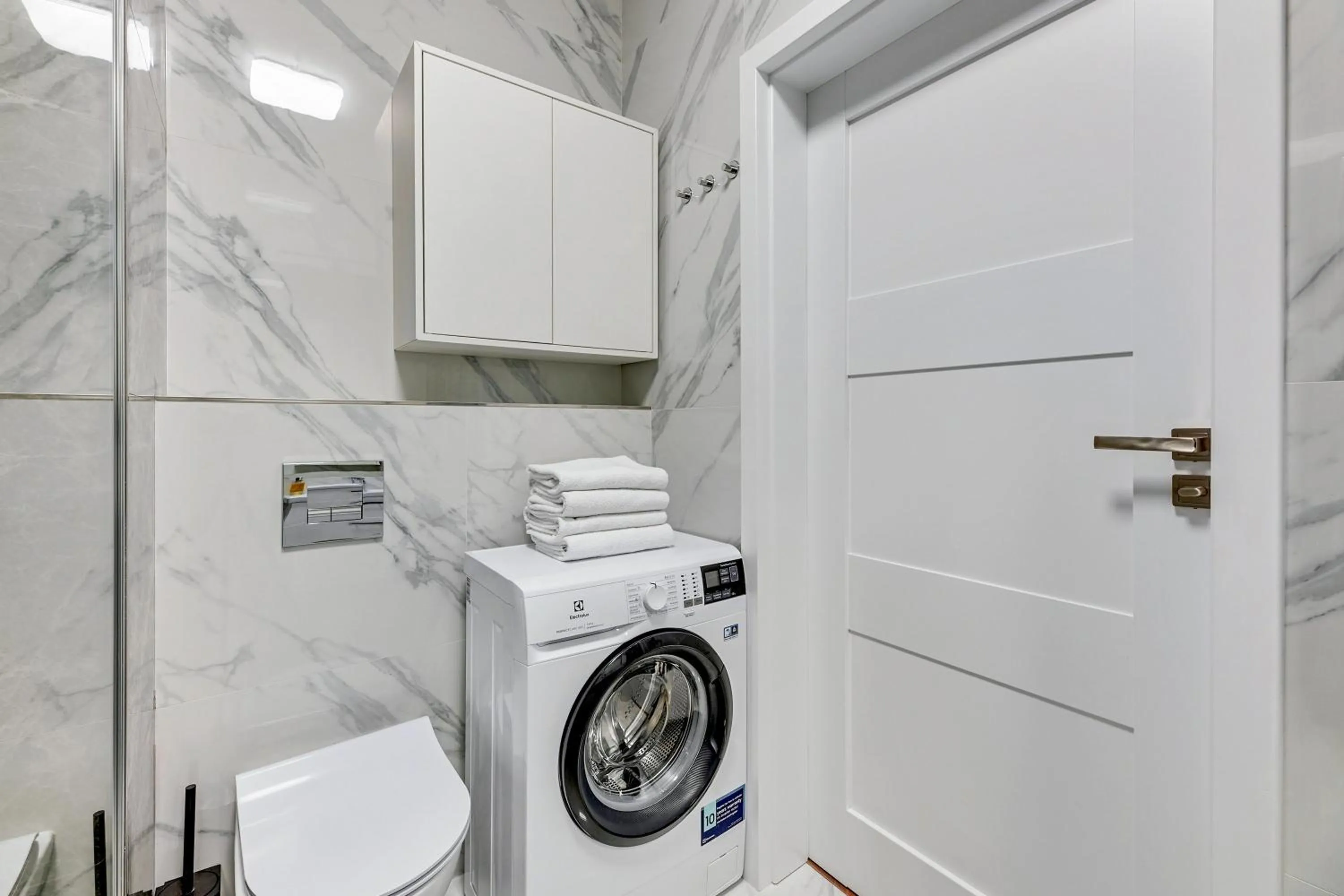 washing machine in GRANO APARTMENTS Gdańsk Residence SPA & Wellness - GRANO APARTMENTS Gdańsk Old Town SPA & Wellness