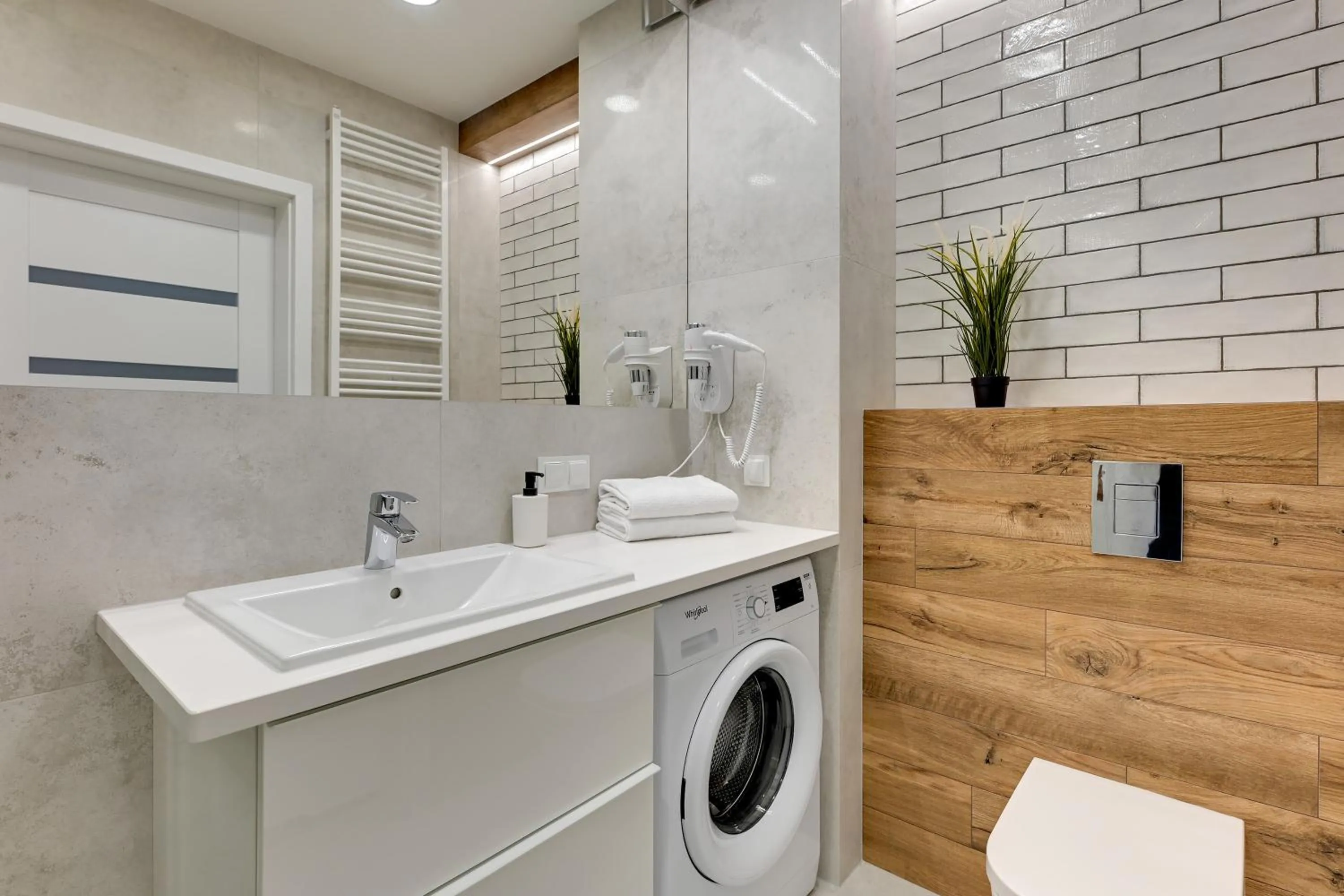 washing machine in GRANO APARTMENTS Gdańsk Residence SPA & Wellness - GRANO APARTMENTS Gdańsk Old Town SPA & Wellness