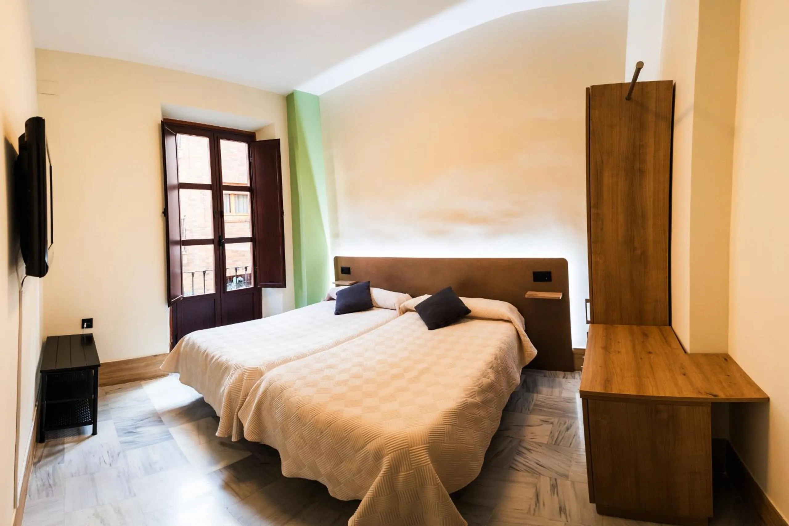 Bed in Apartamentos Reyes Católicos