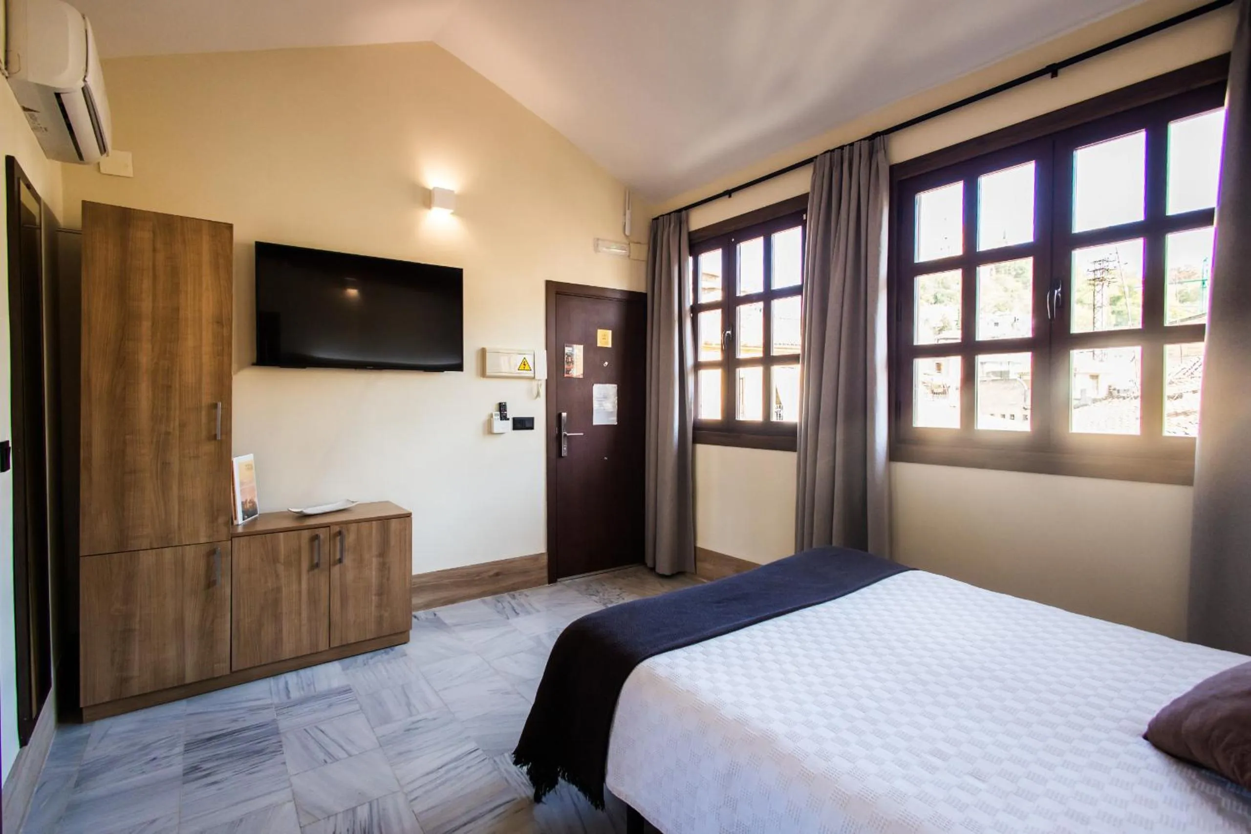 Bed in Apartamentos Reyes Católicos