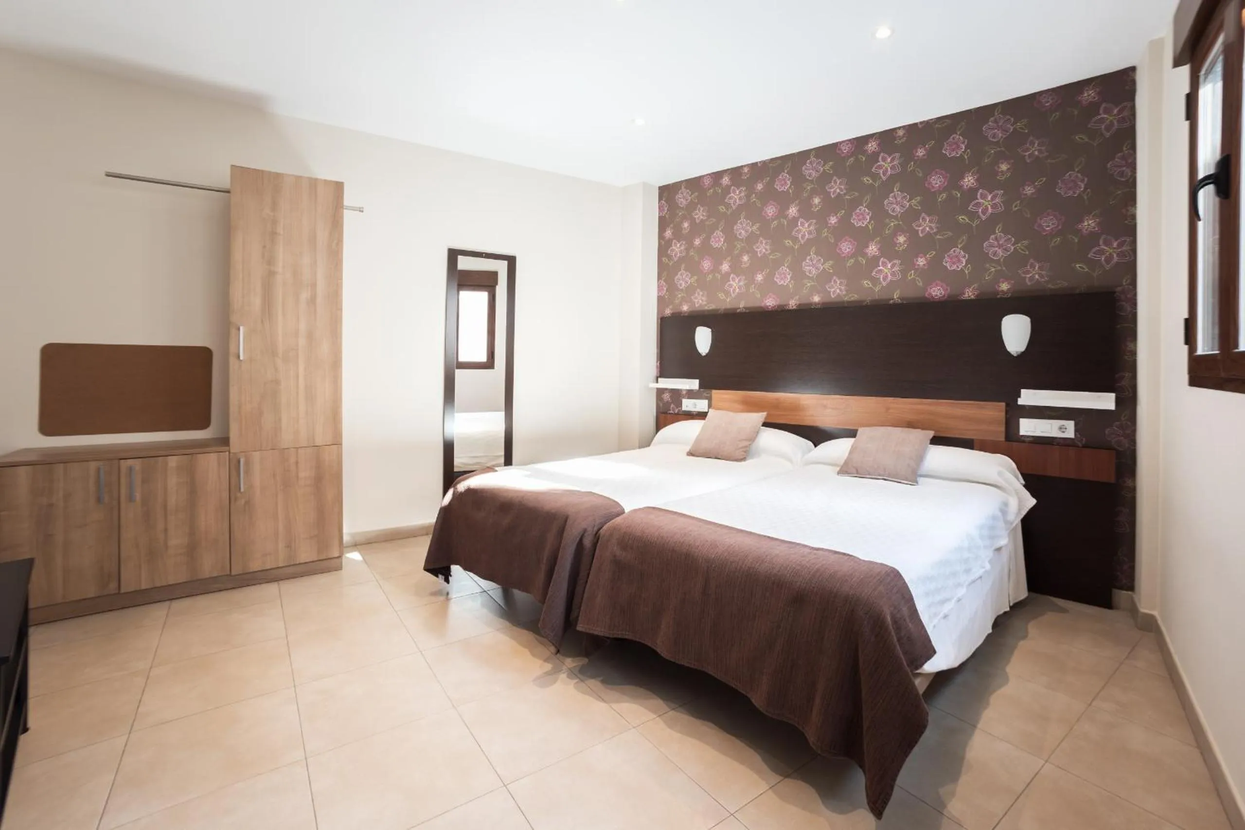 Bed in Apartamentos Reyes Católicos