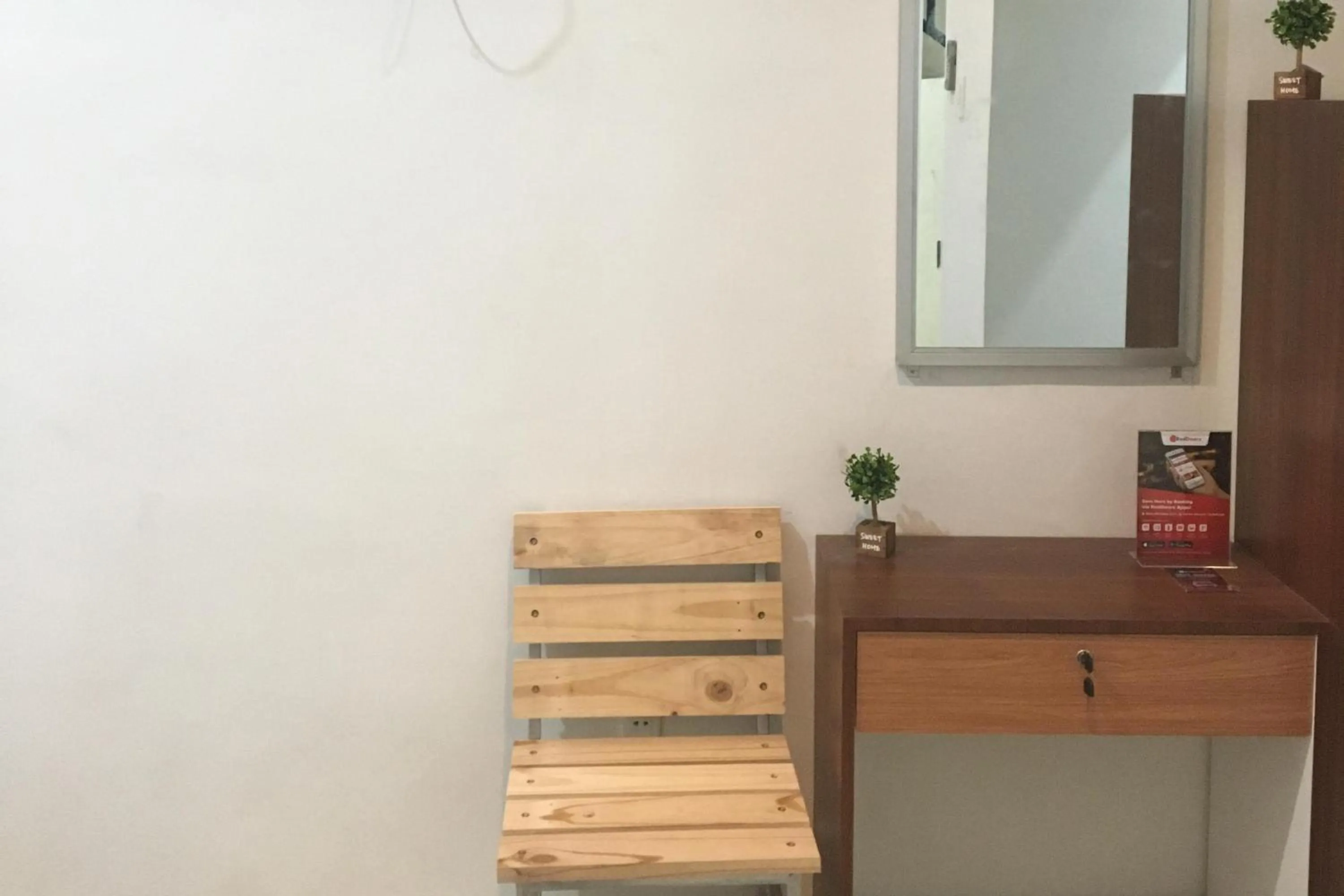 Property logo or sign in RedDoorz near Institut Kesehatan Helvetia