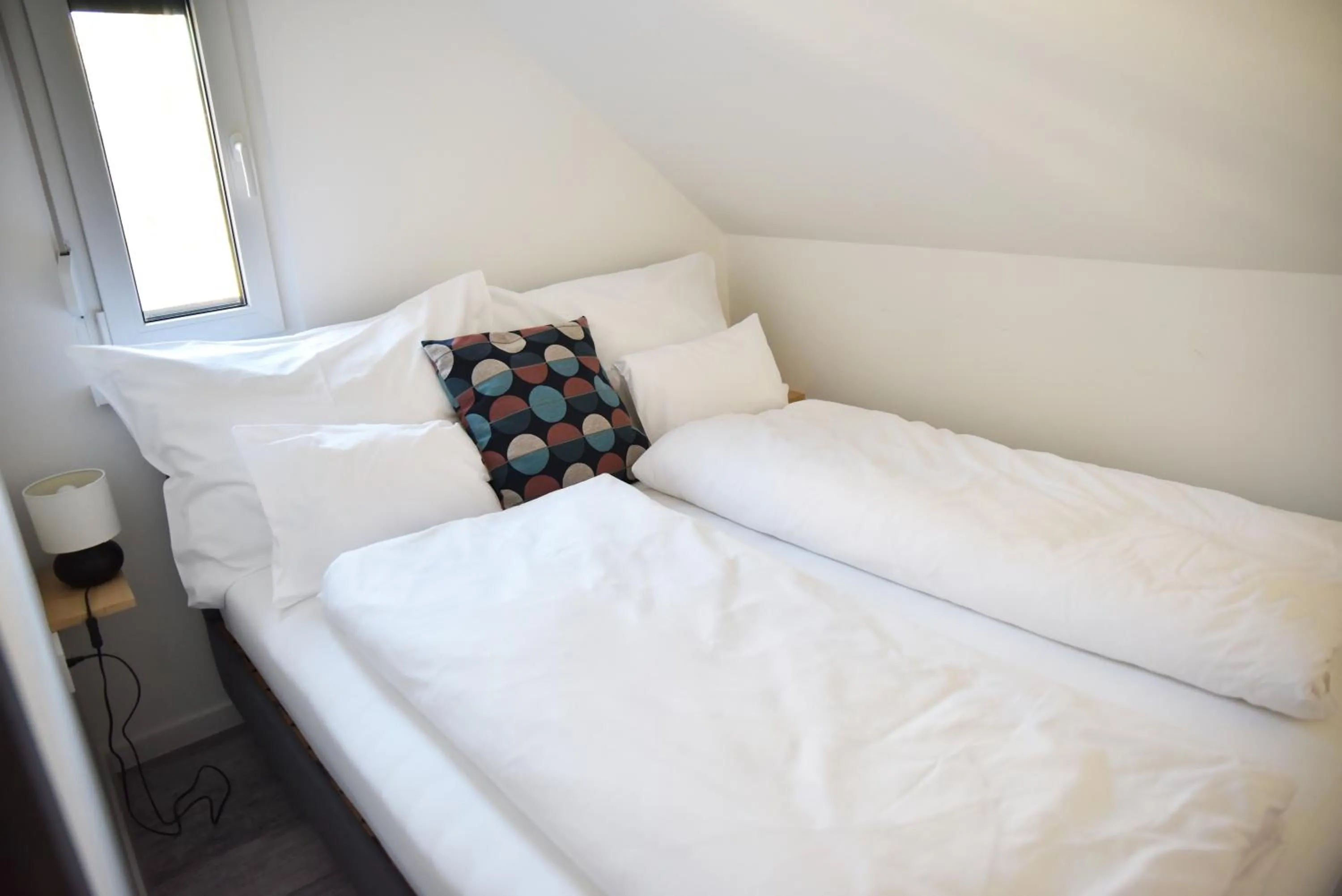 Bed in Roomstore Studio Apartments