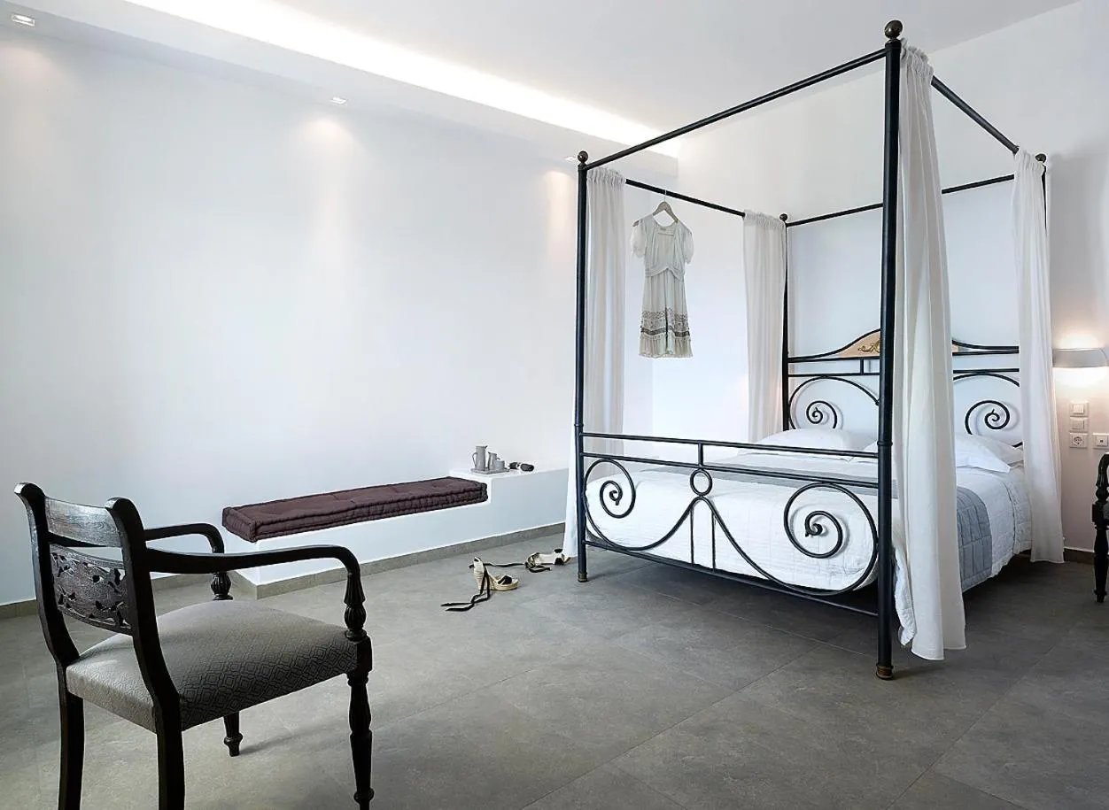 Seating area, Bed in Santa Maria Luxury Suites & Spa