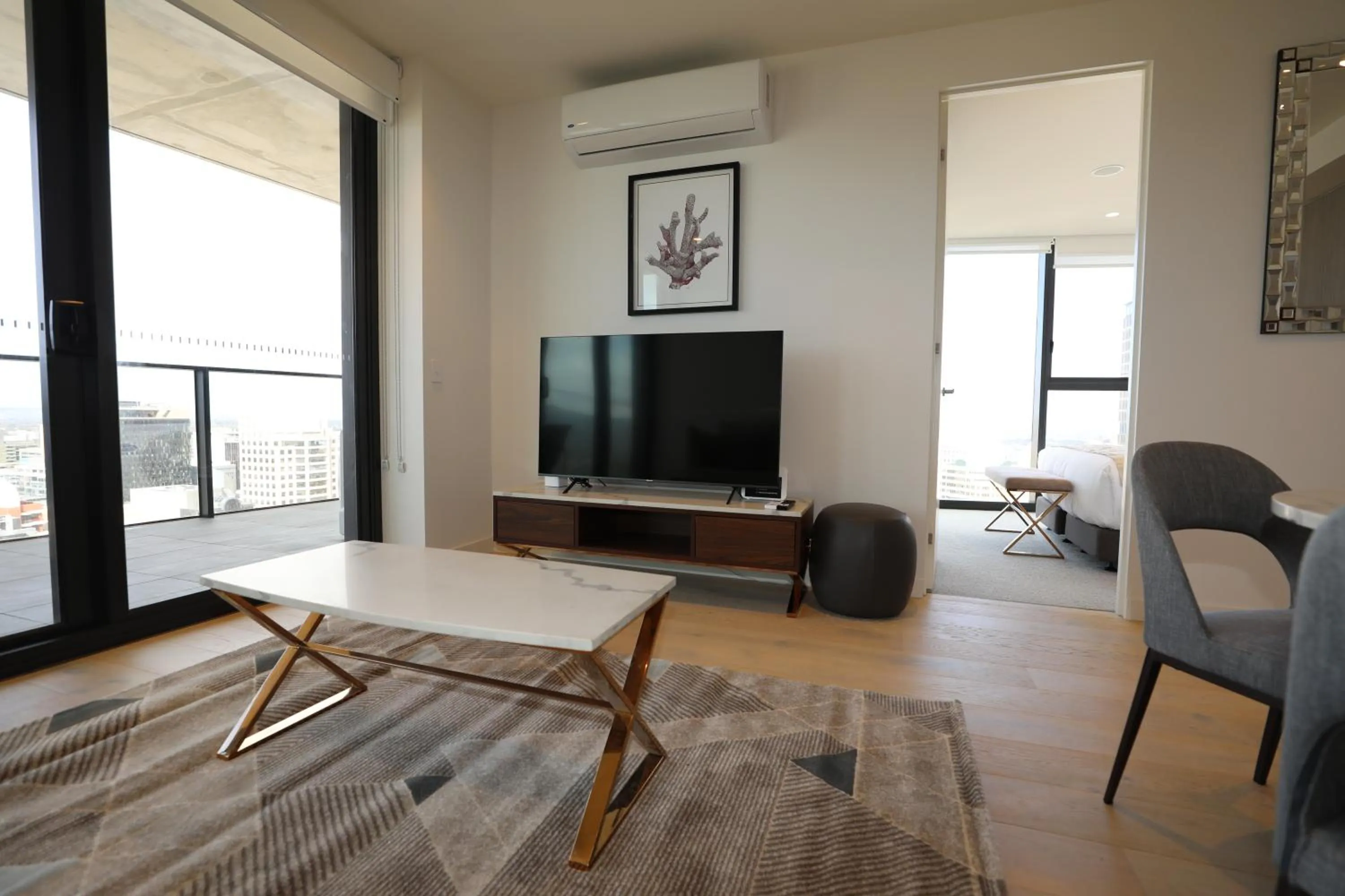 Living room in Realm Apartments by CLLIX