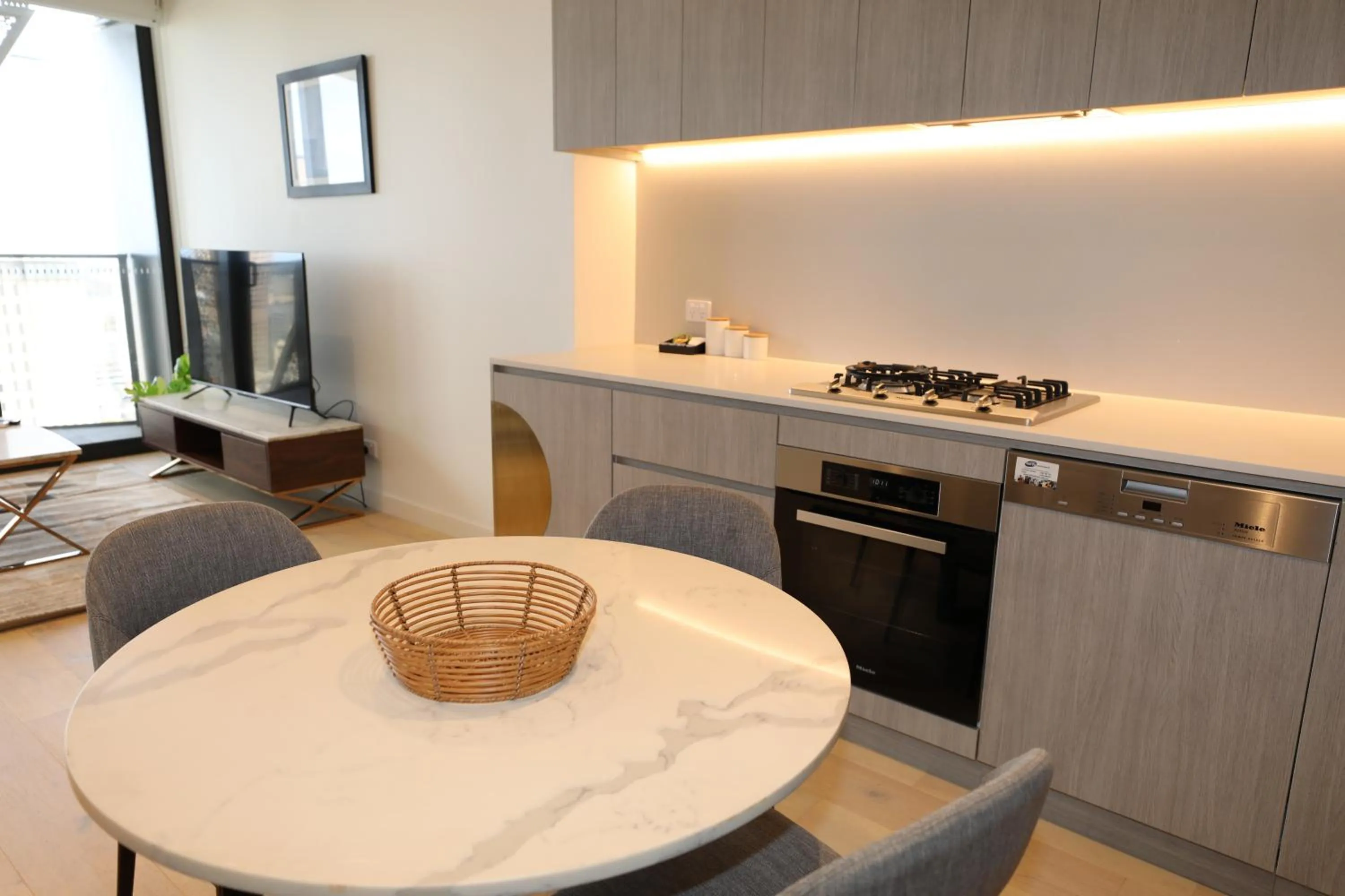 TV and multimedia in Realm Apartments by CLLIX