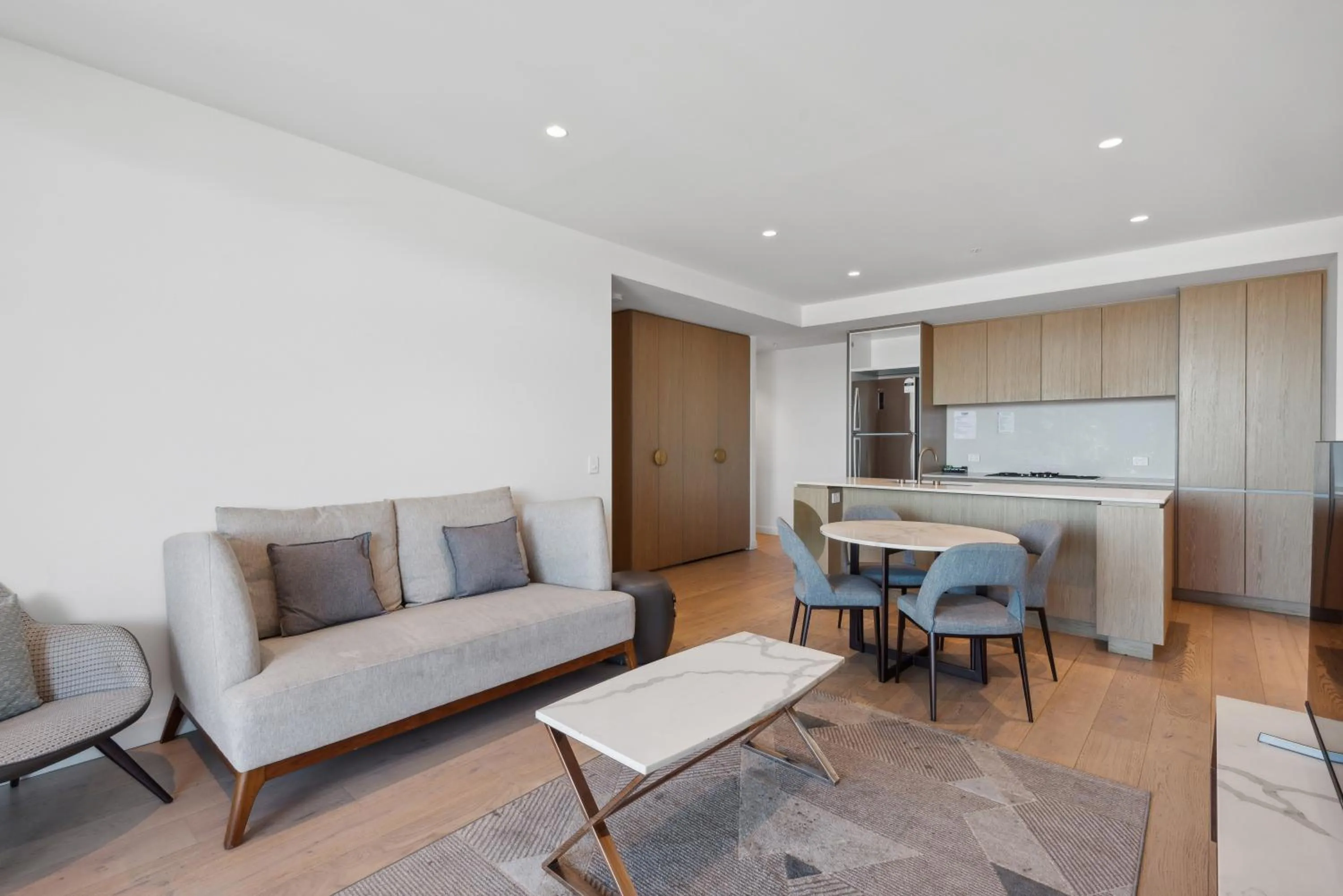 Living room in Realm Apartments by CLLIX