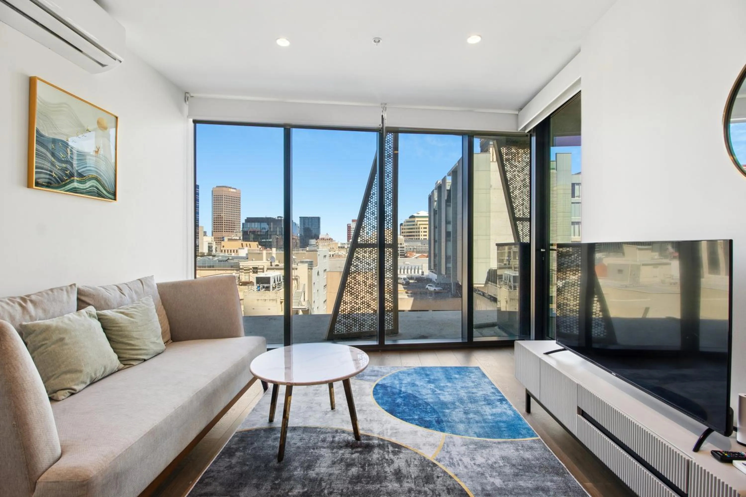 Living room in Realm Apartments by CLLIX