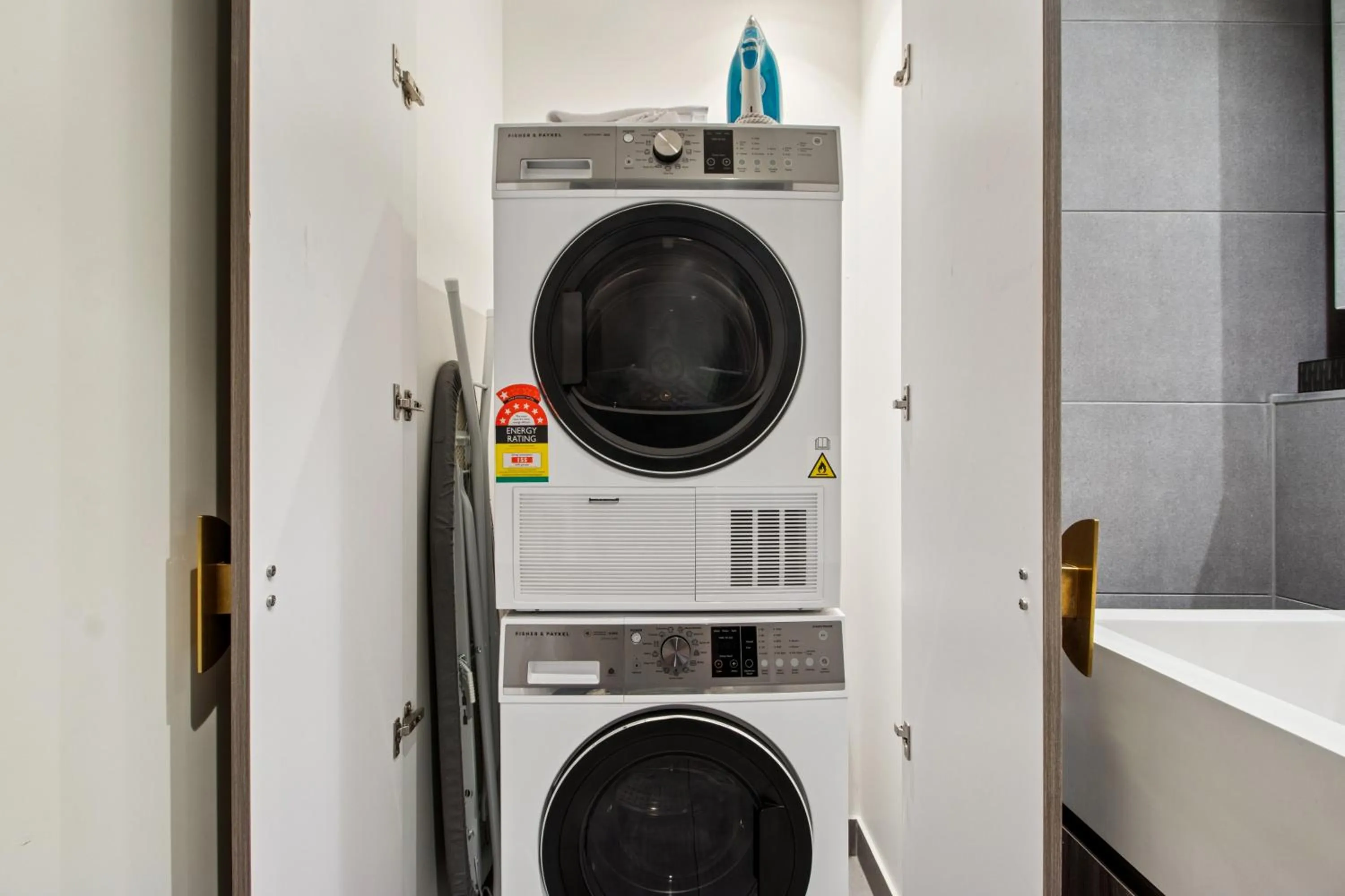 washing machine in Realm Apartments by CLLIX