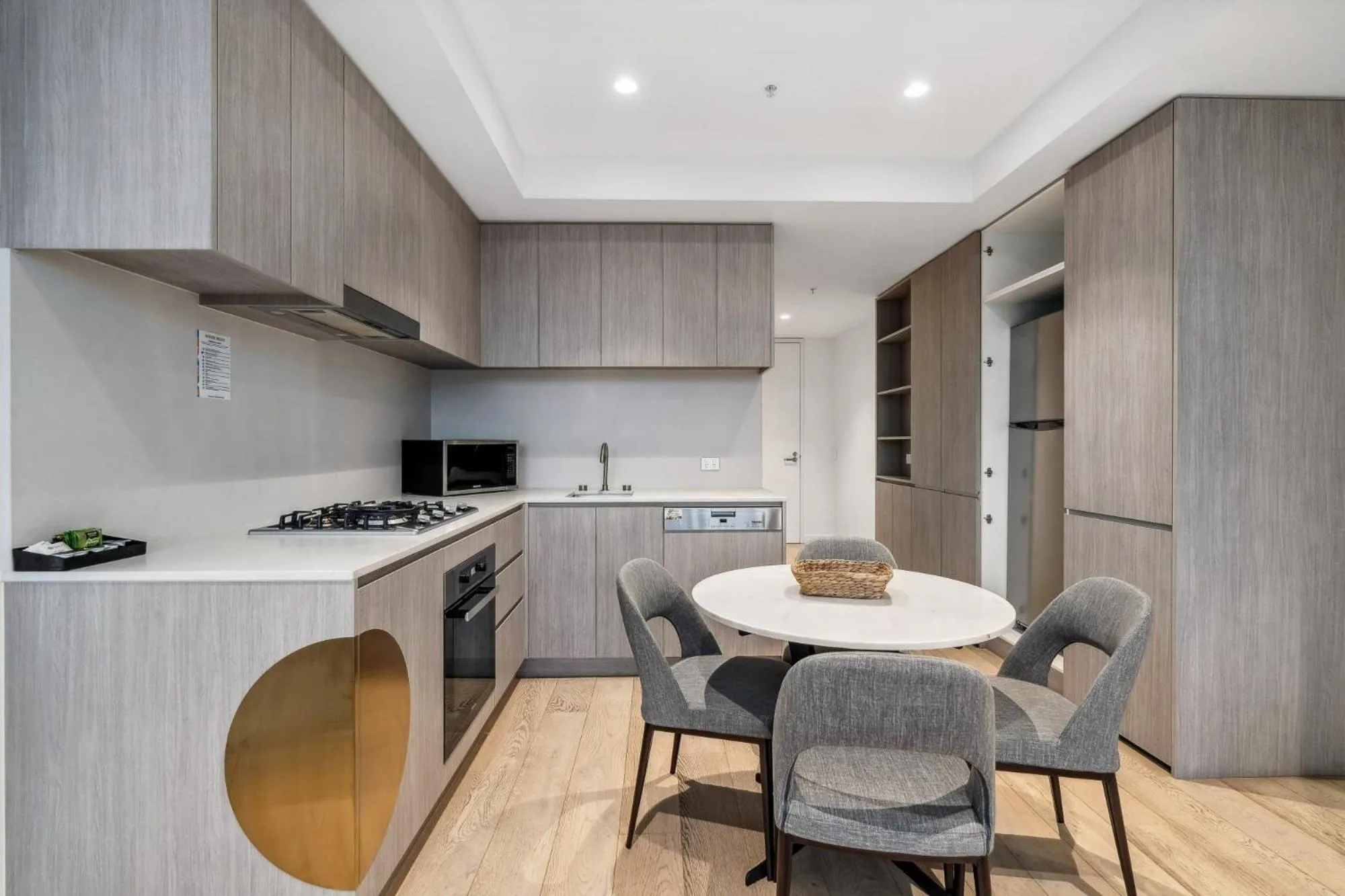 Kitchen or kitchenette in Realm Apartments by CLLIX