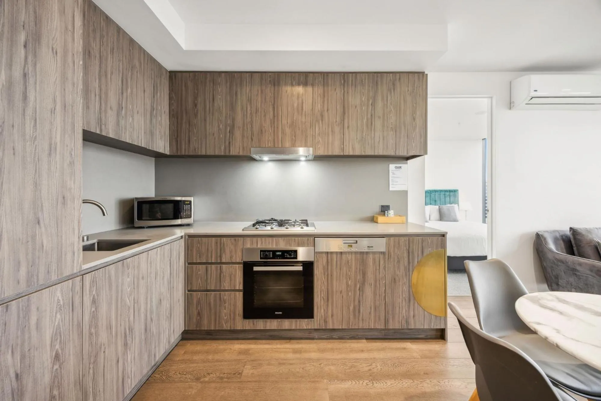 Kitchen or kitchenette in Realm Apartments by CLLIX