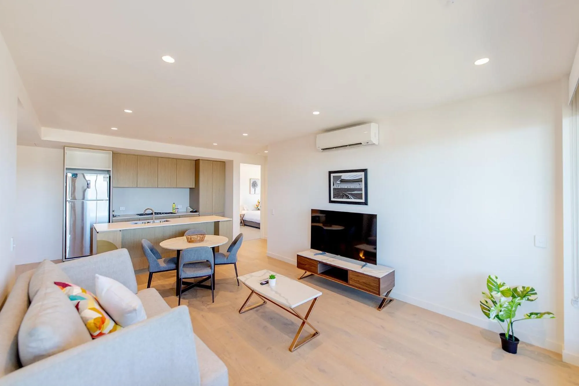 TV and multimedia in Realm Apartments by CLLIX