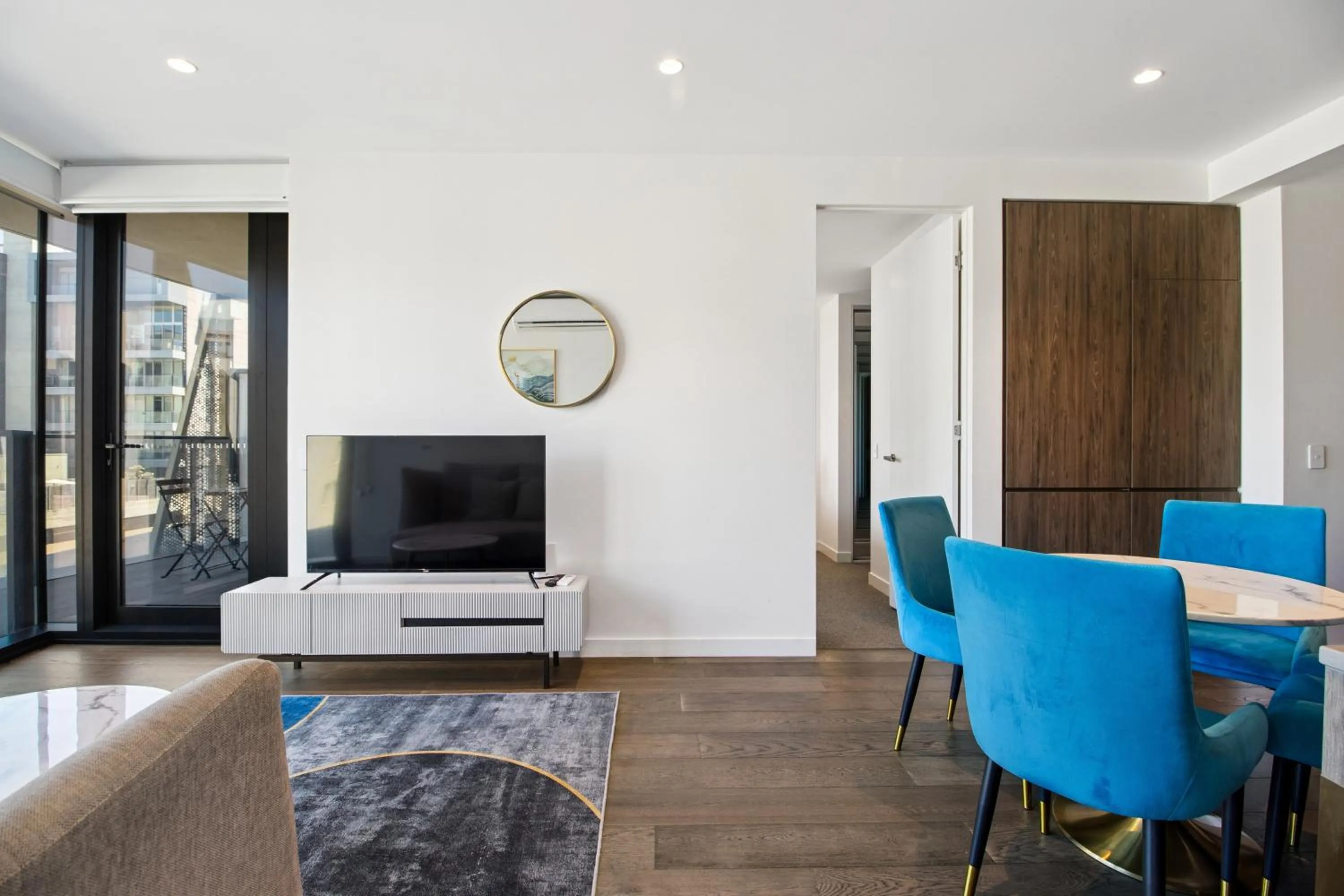 TV and multimedia in Realm Apartments by CLLIX