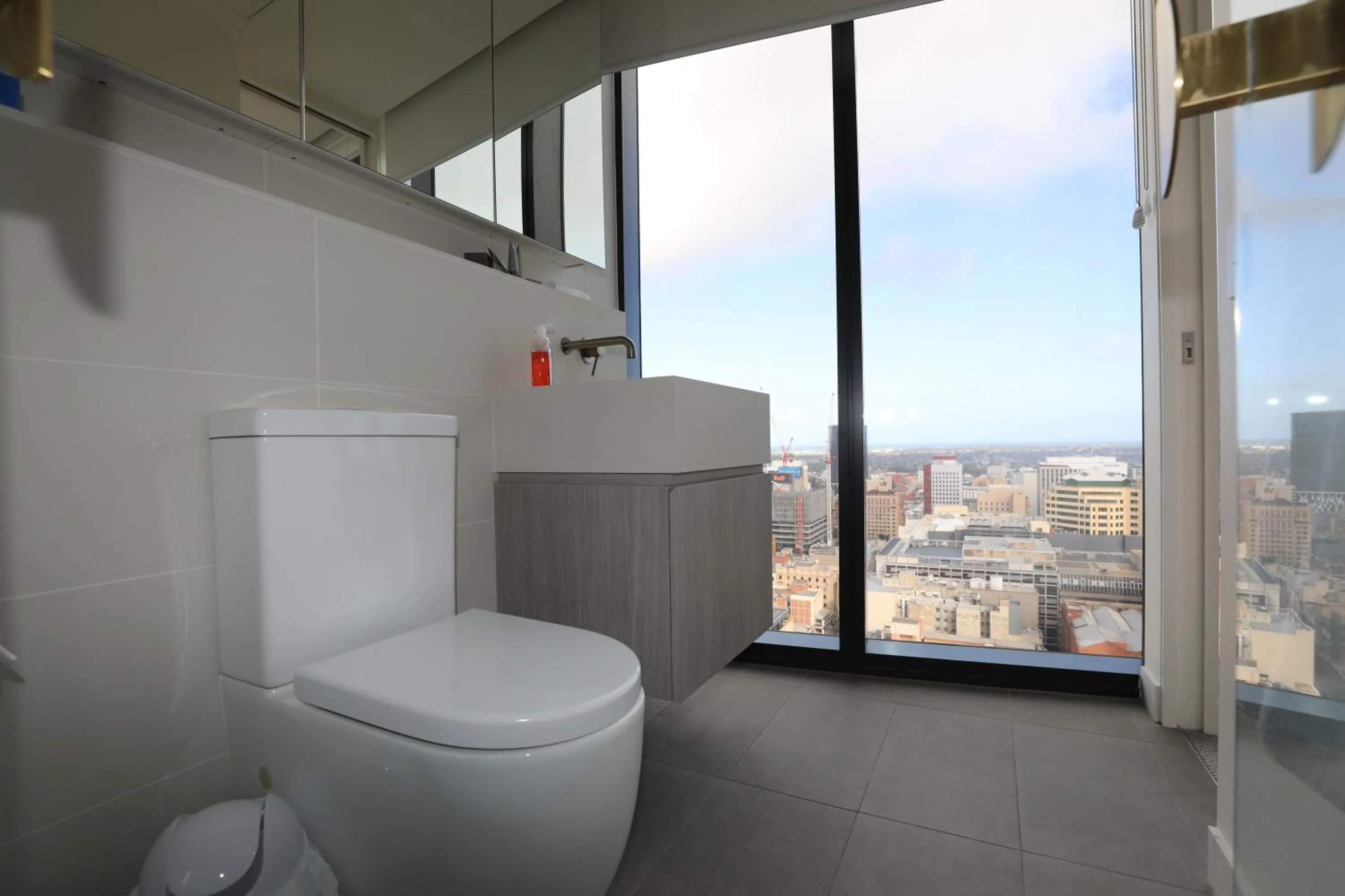 Toilet in Realm Apartments by CLLIX